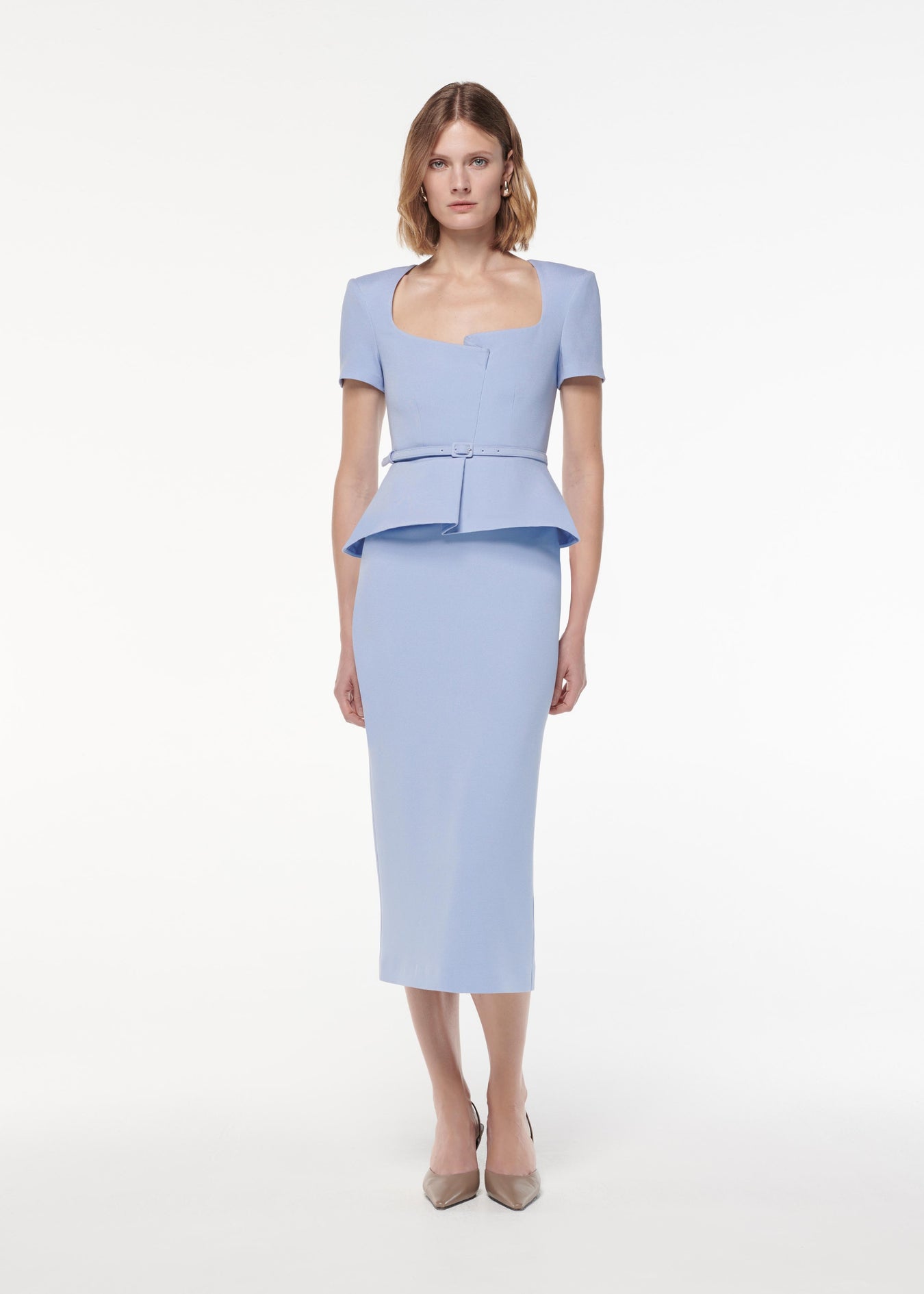 A photograph of a woman wearing a Short Sleeve Stretch Wool Silk Midi Dress in Blue