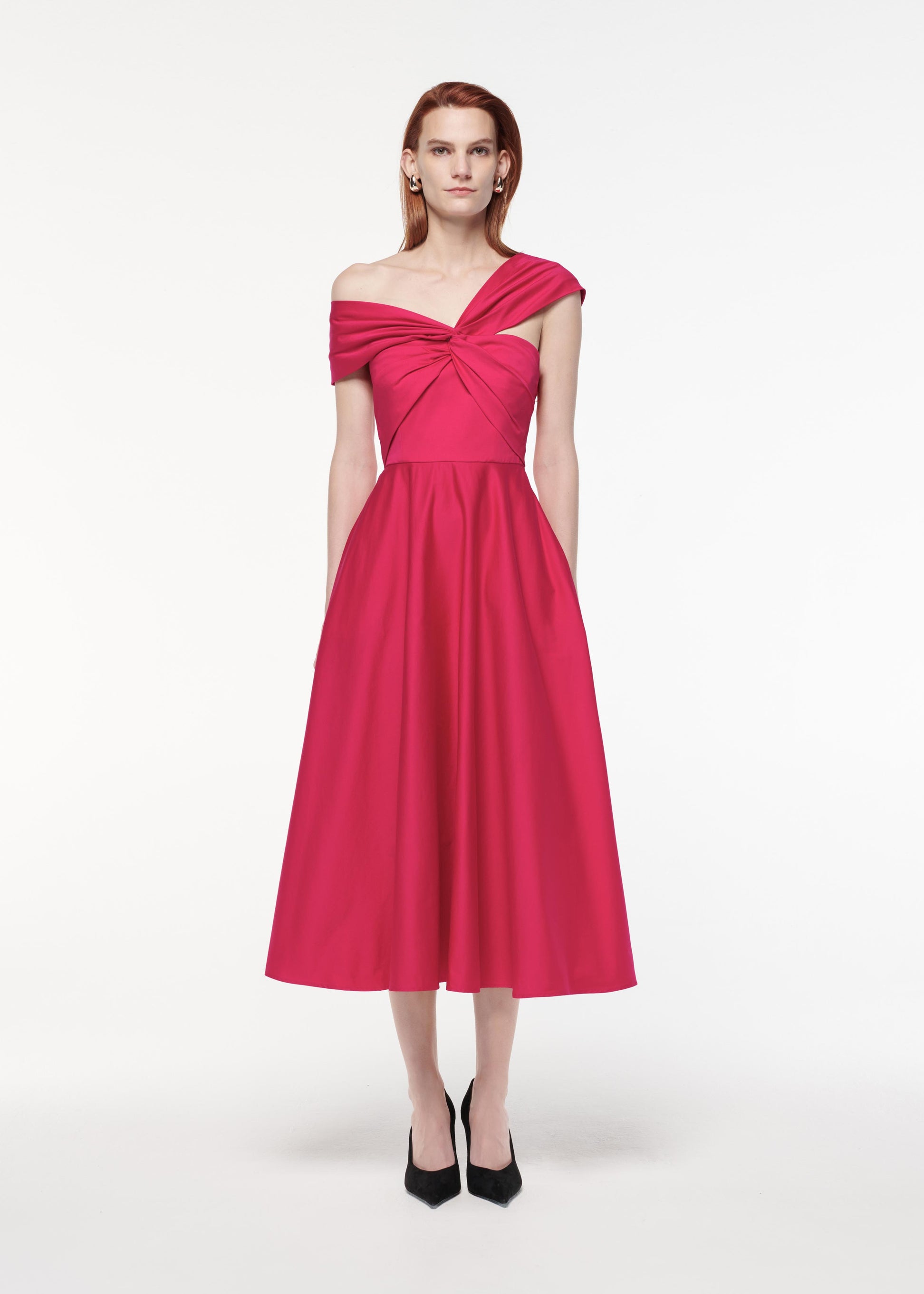 A photograph of a woman wearing a Asymmetric Stretch Cotton Poplin Midi Dress in Pink