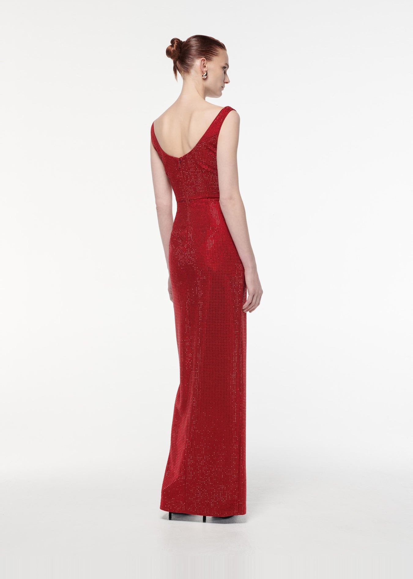 A photograph of a woman wearing a Diamante Gown in Red