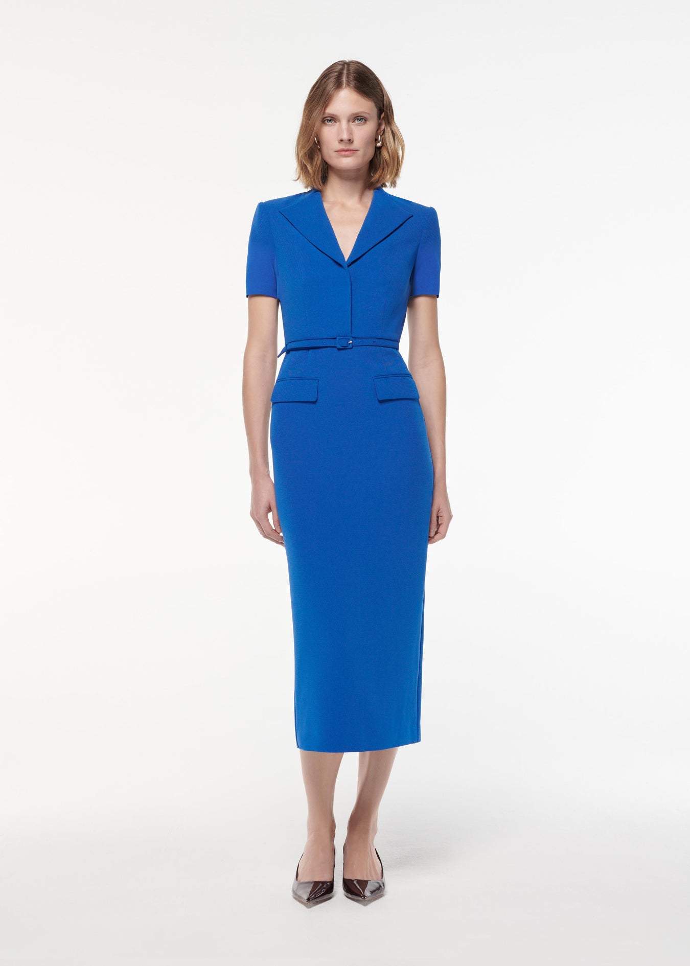 A photograph of a woman wearing a Short Sleeve Collar Heavy Cady Midi Dress in Blue
