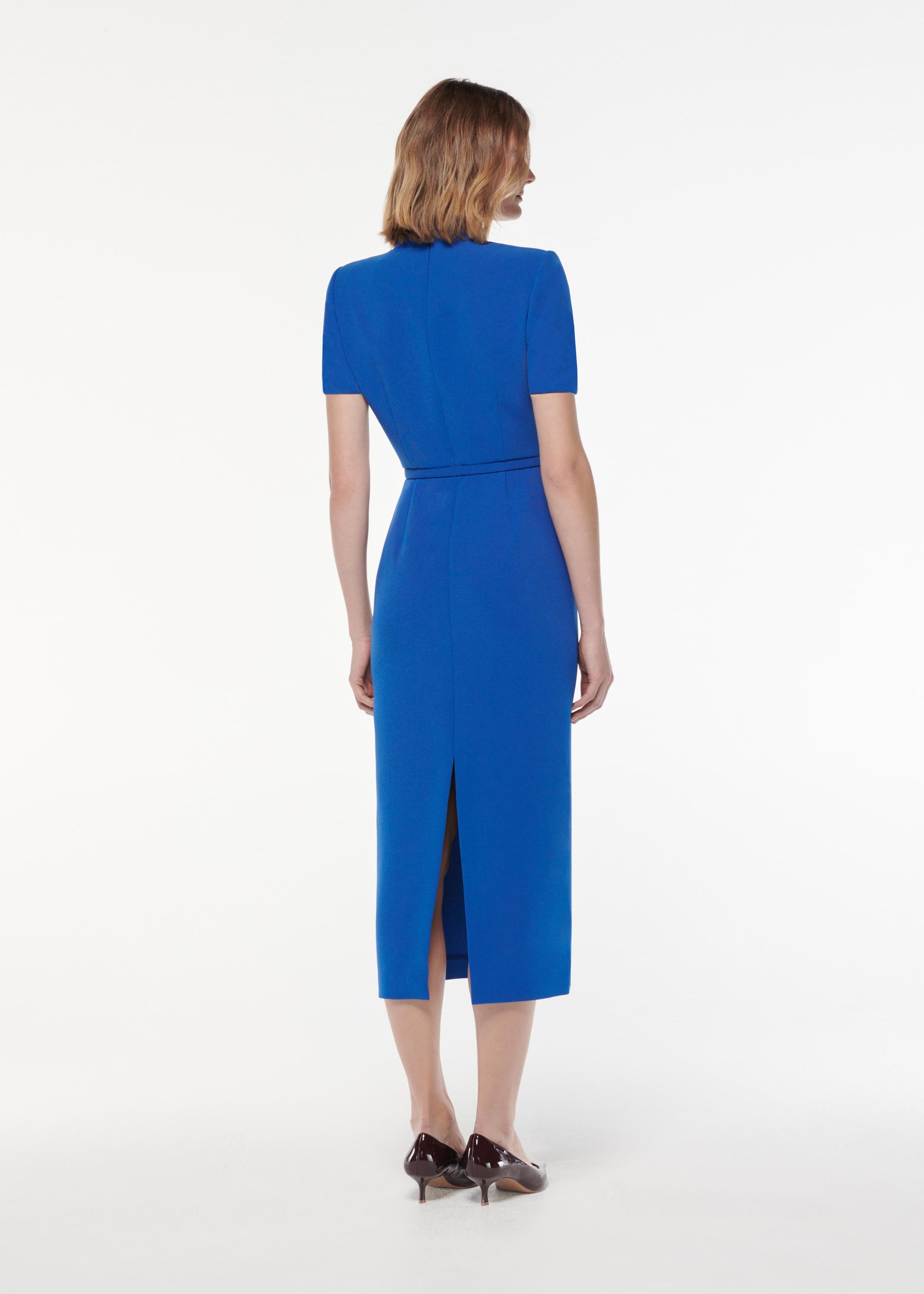 A photograph of a woman wearing a Short Sleeve Collar Heavy Cady Midi Dress in Blue