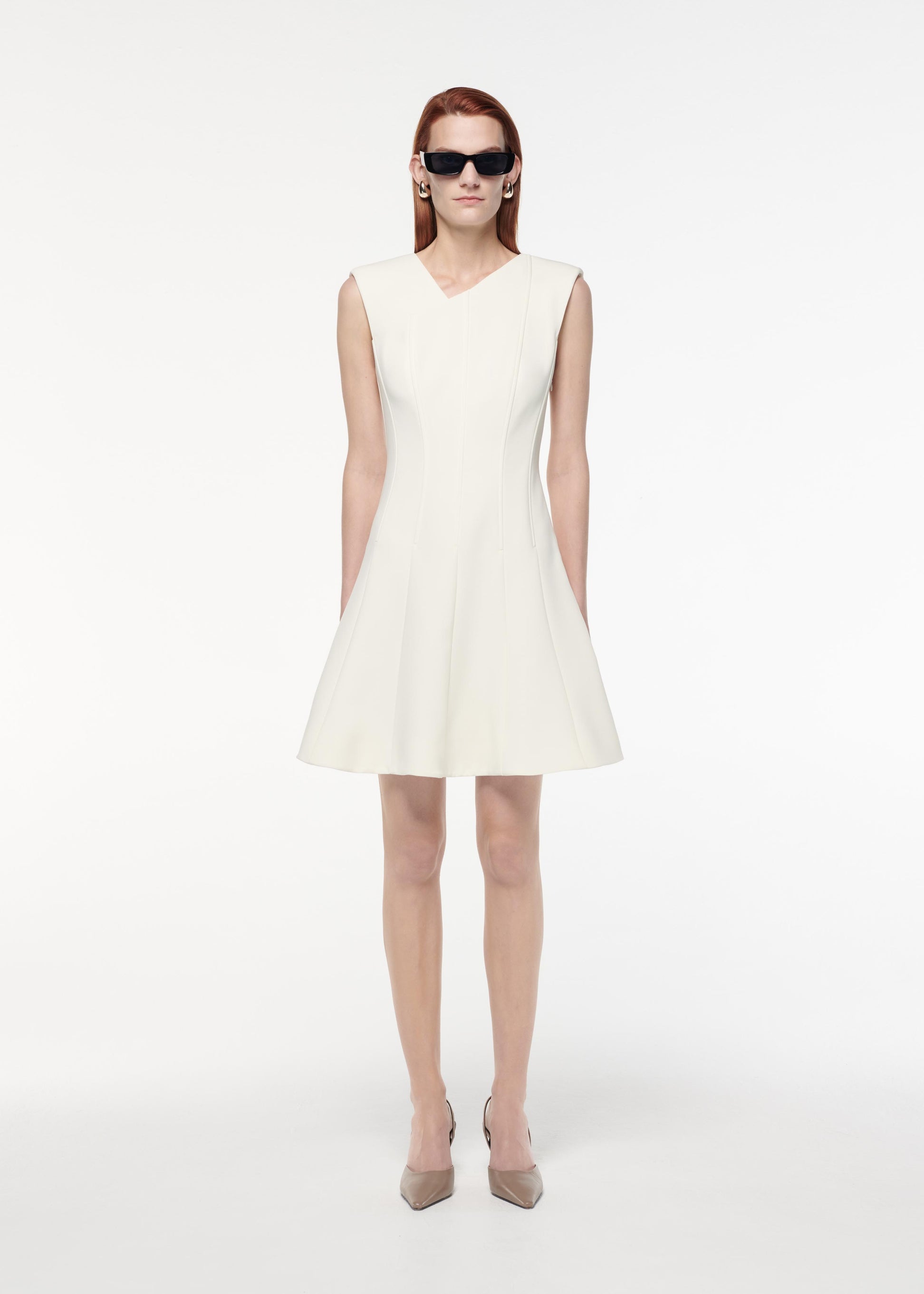 A photograph of a woman wearing a Stretch Wool Silk Midi Dress in Blue