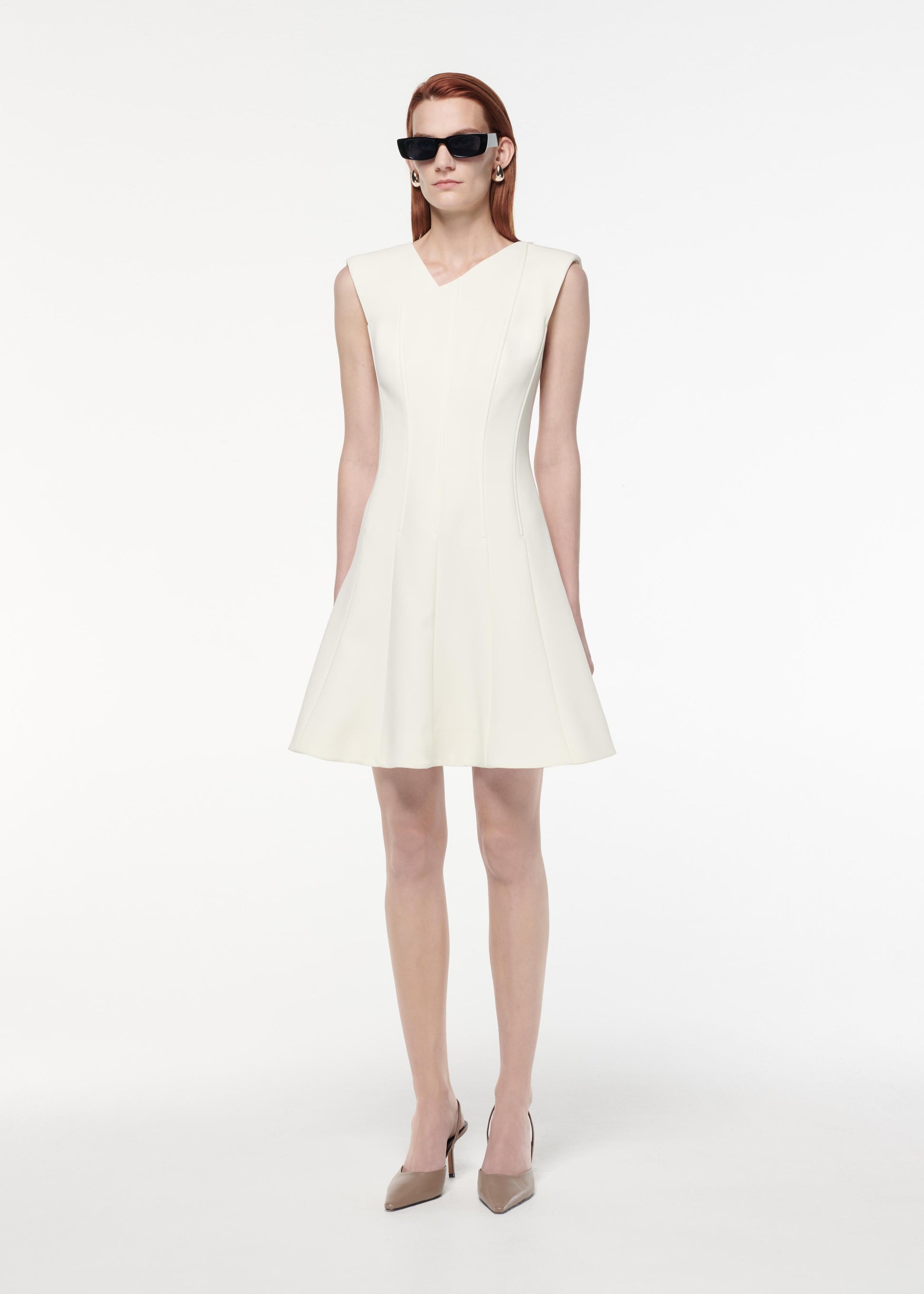 A photograph of a woman wearing a Stretch Wool Silk Midi Dress in Blue