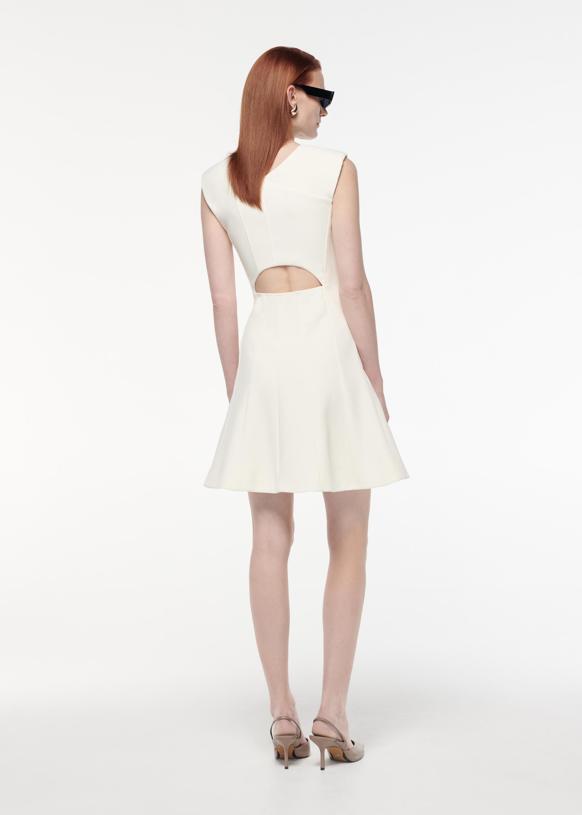 A photograph of a woman wearing a Stretch Wool Silk Midi Dress in Blue