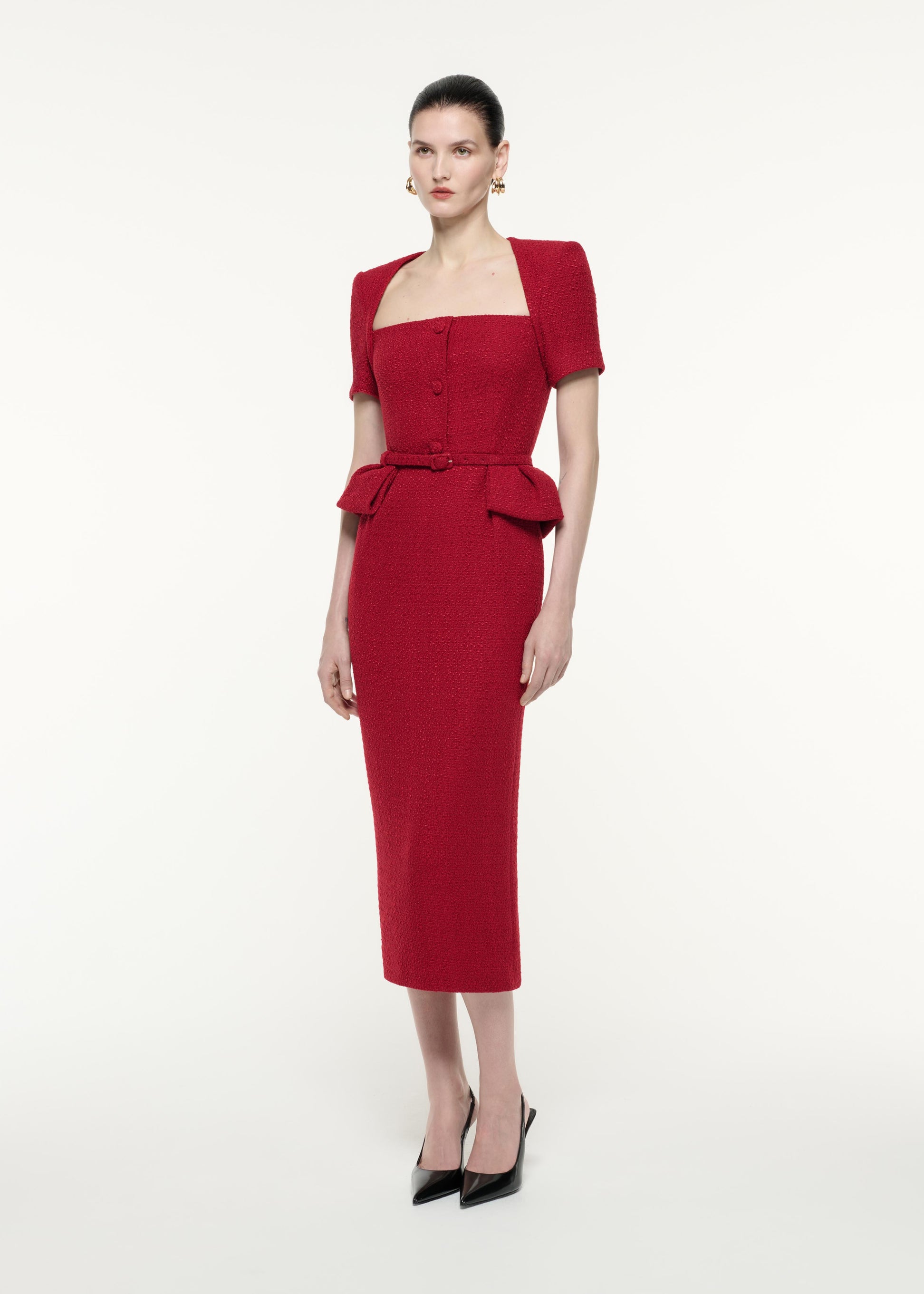 A side view image of a model wearing the Short Sleeve Boucle Midi Dress in Red