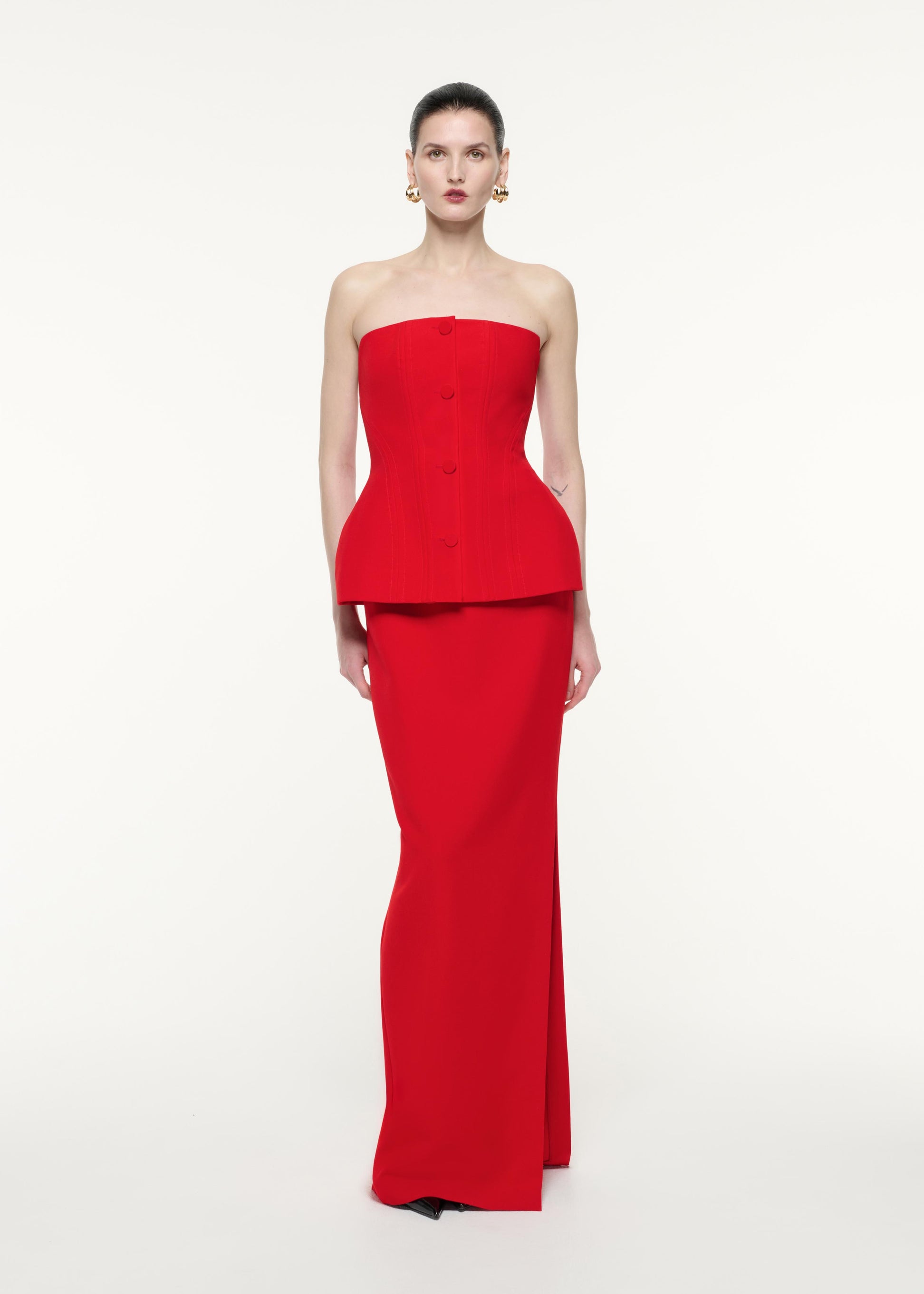 Front view of a model wearing the Strapless Tailored Crepe Gown in Red