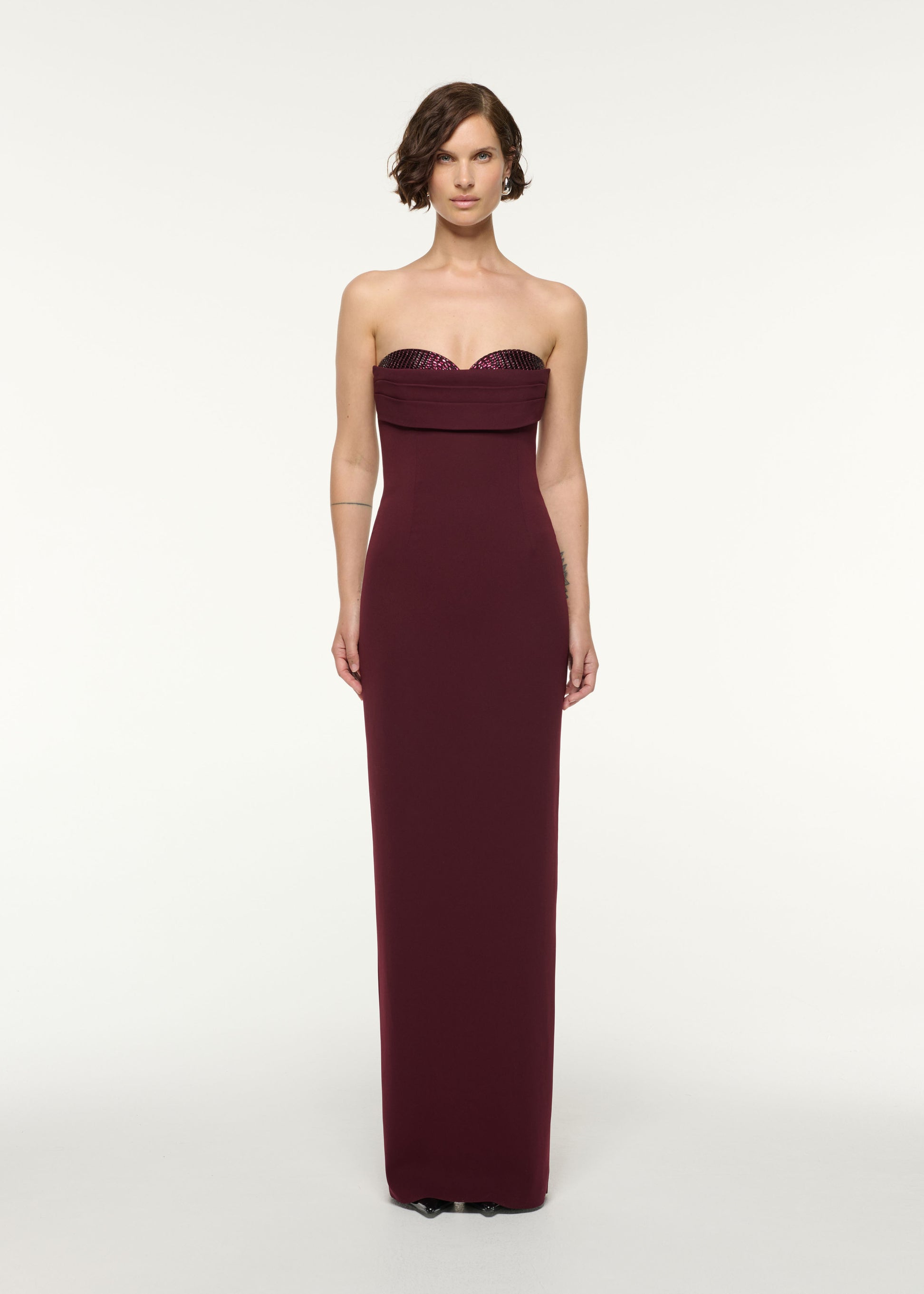 Front view of a model wearing the Diamante Peek-A-Boo Bust Column Gown in Mulberry