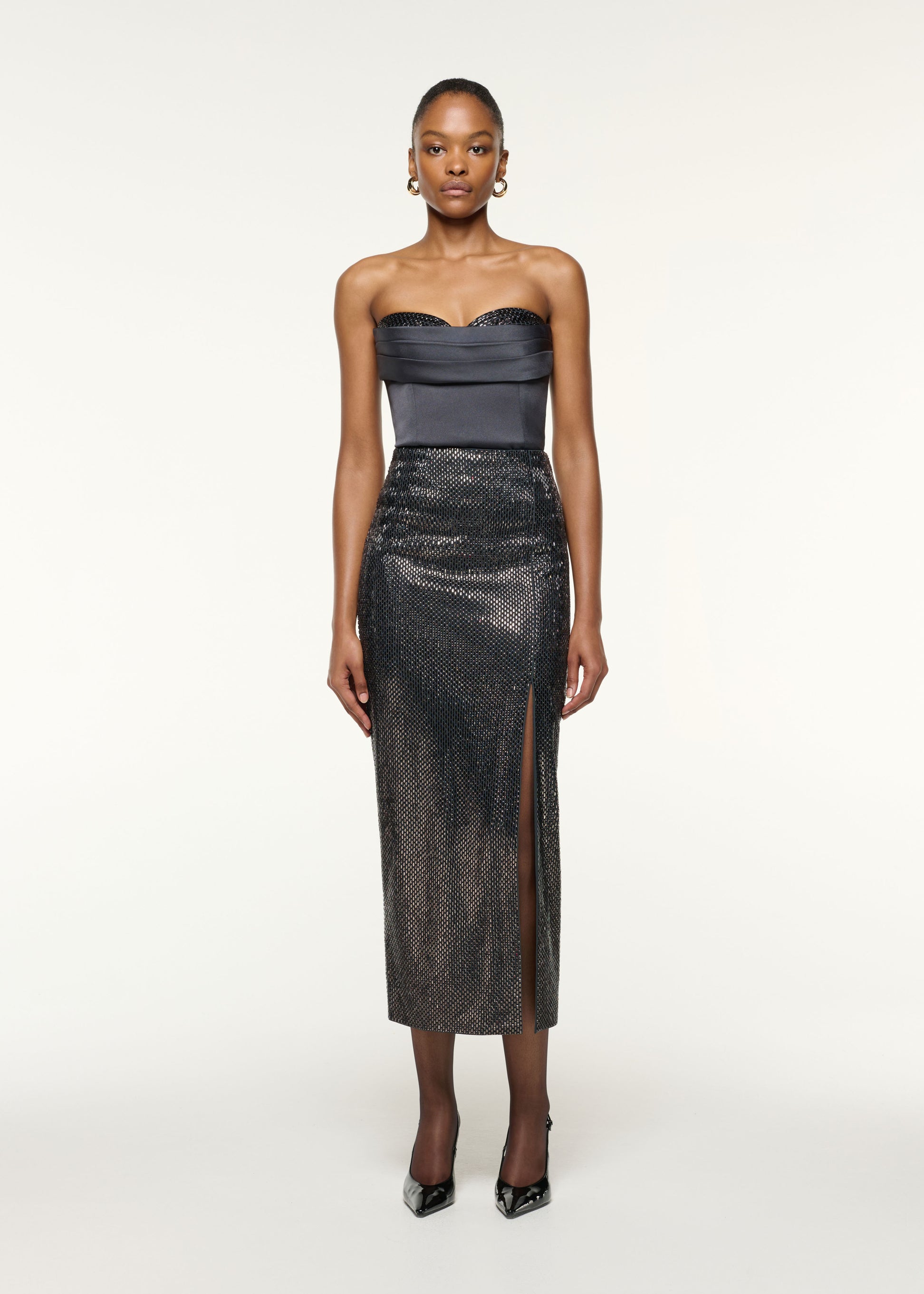 Front view of a model wearing the Diamante Peek-A-Boo Bust Satin Top in Grey