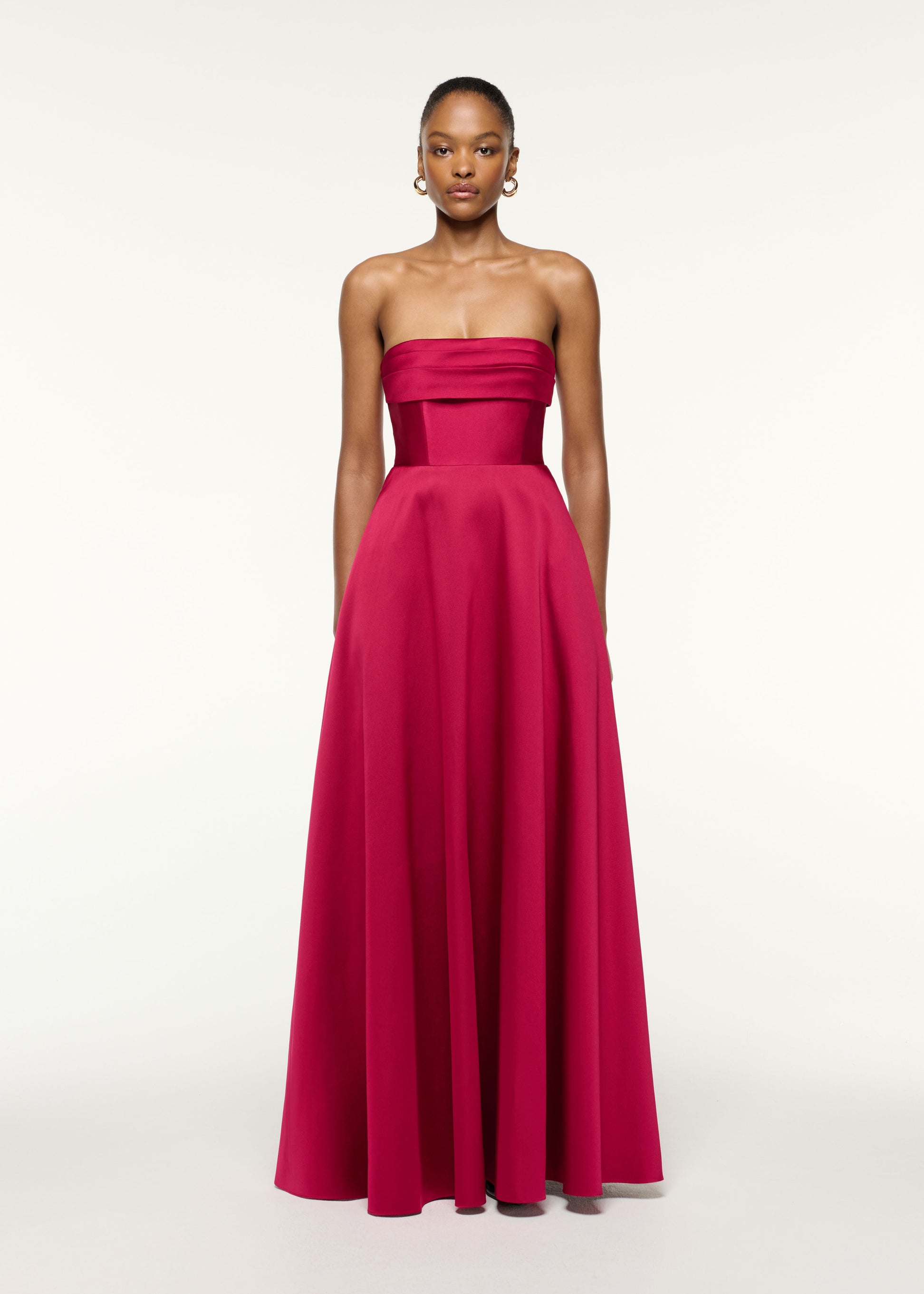 Front view of a model wearing the Pleated Bust Taffeta Evening Gown in Pink