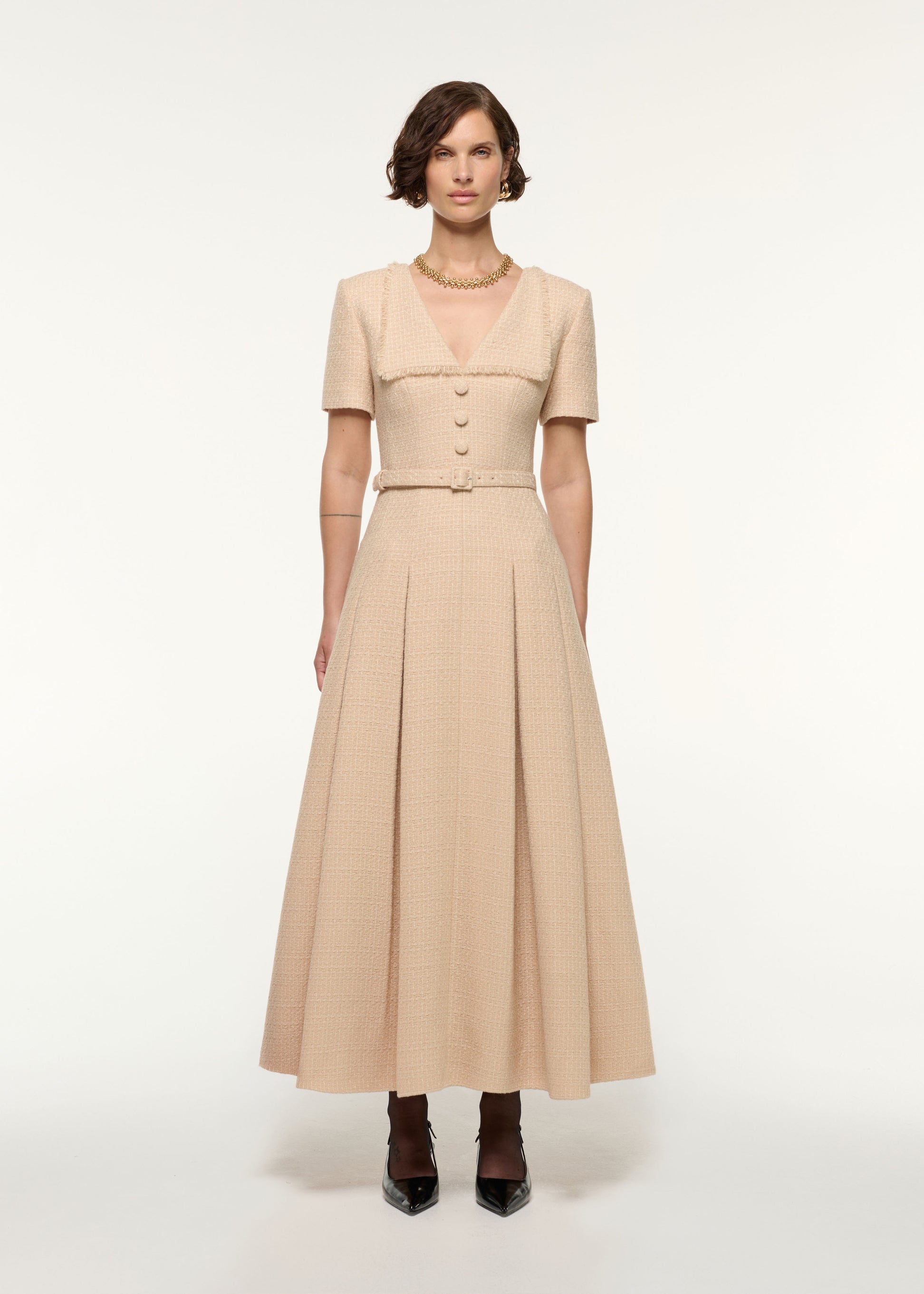 Front view of a model wearing the Folded Collar Belted Boucle Dress in Dark Cream