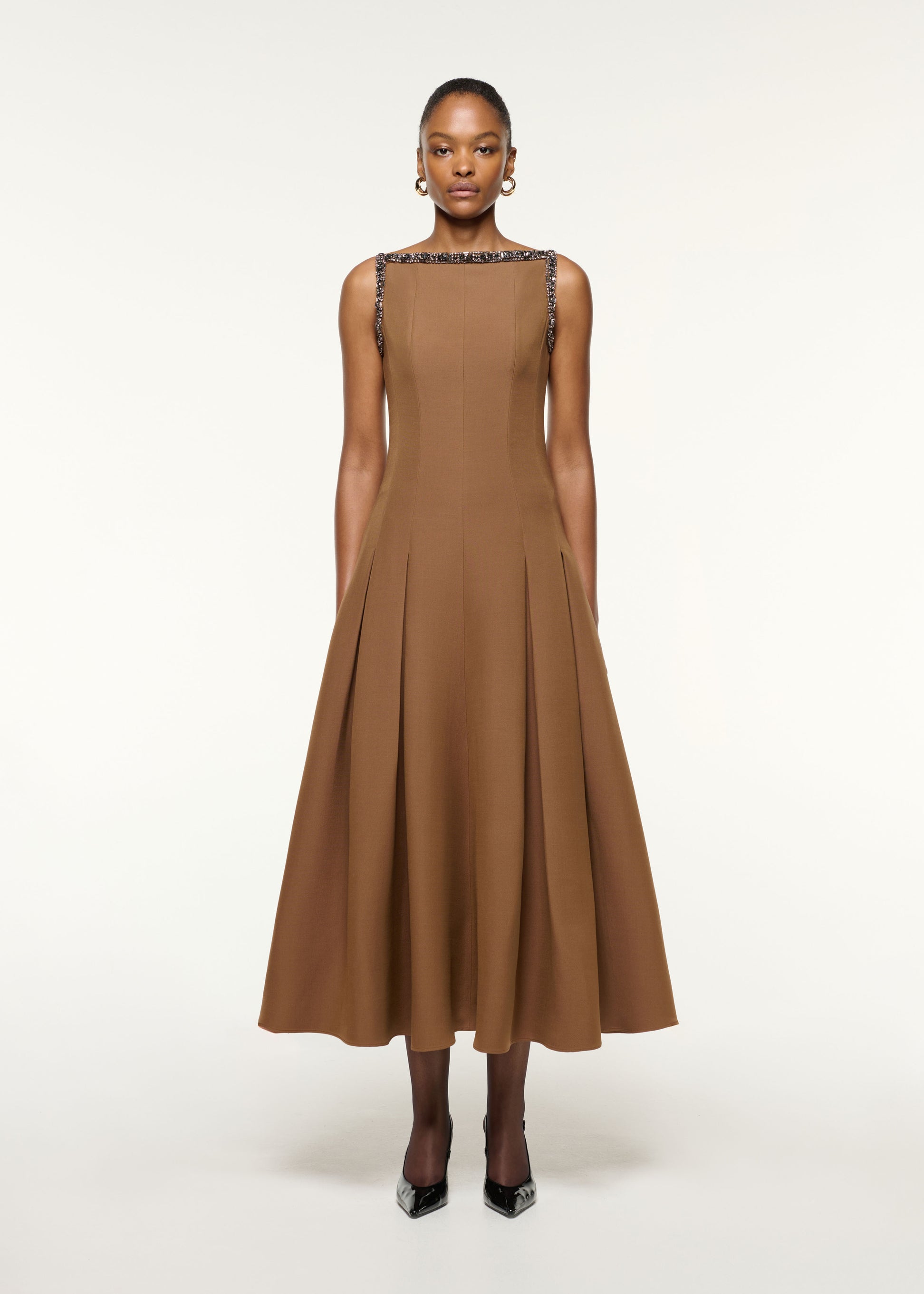 Front view of a model wearing the Wool Silk Crystal Trimmed Pleat Dress in Brown