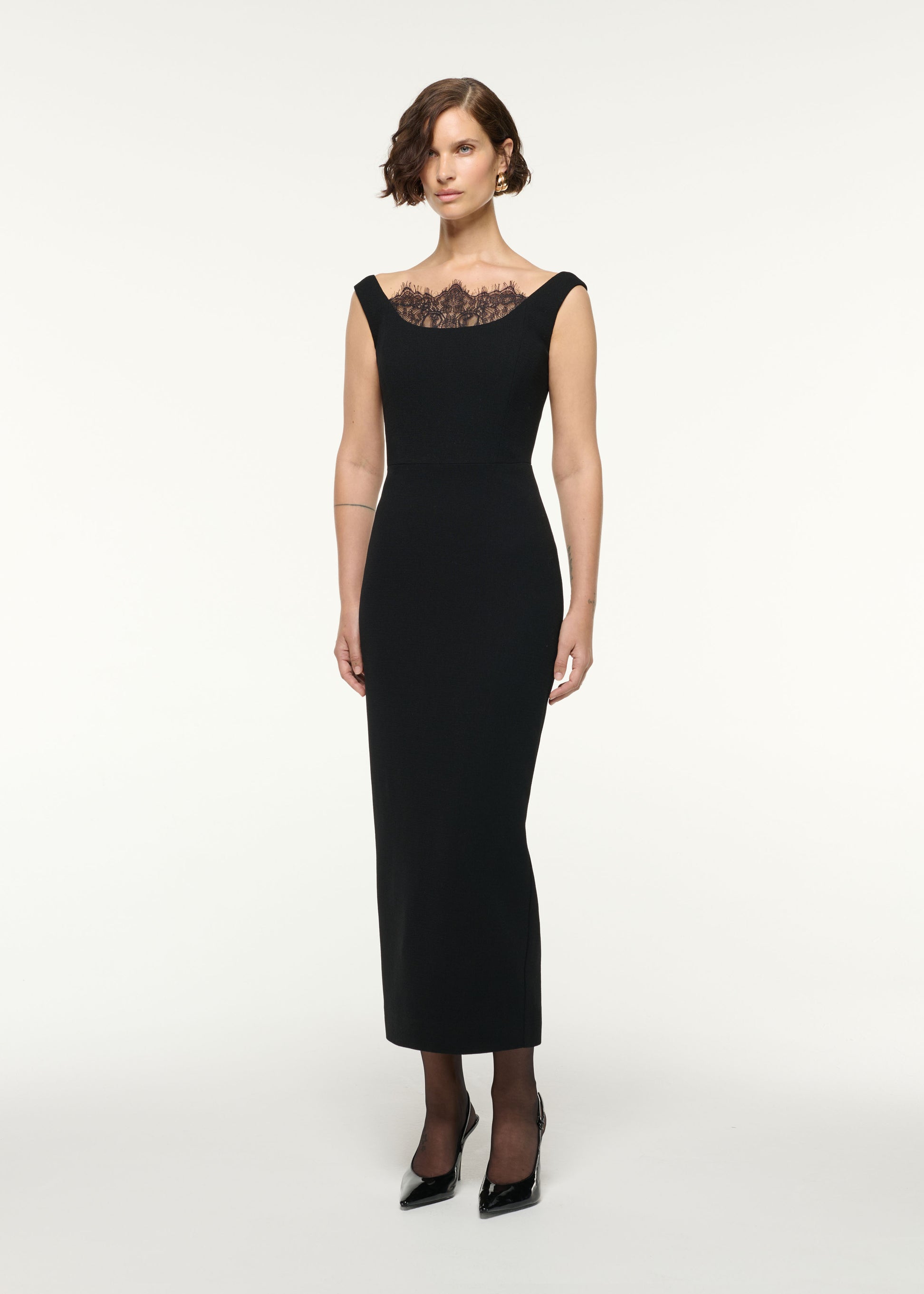 Side view of a model wearing the Scallop Lace Insert Wool Cocktail Dress in Black