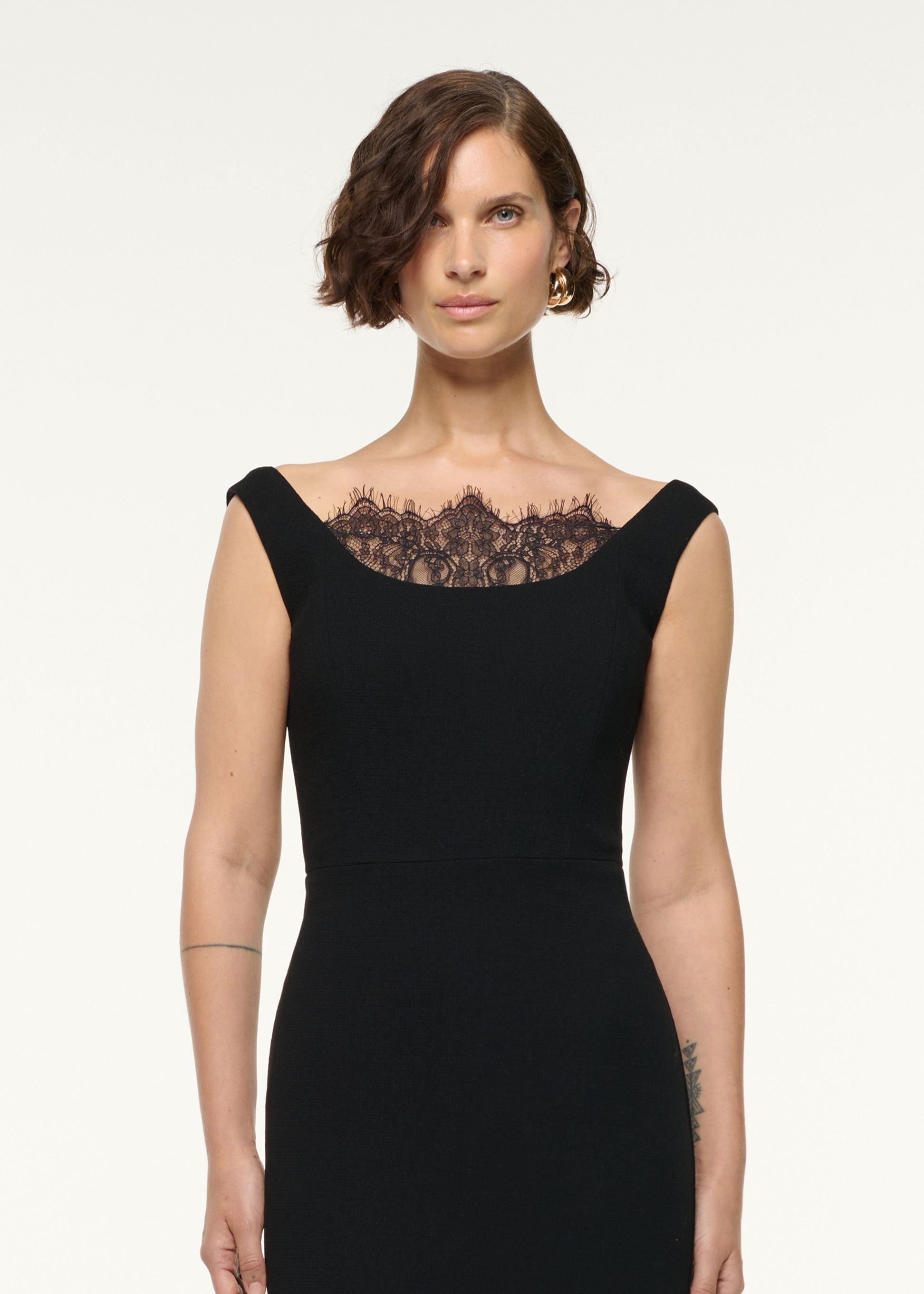 Close up of a model wearing the Scallop Lace Insert Wool Cocktail Dress in Black