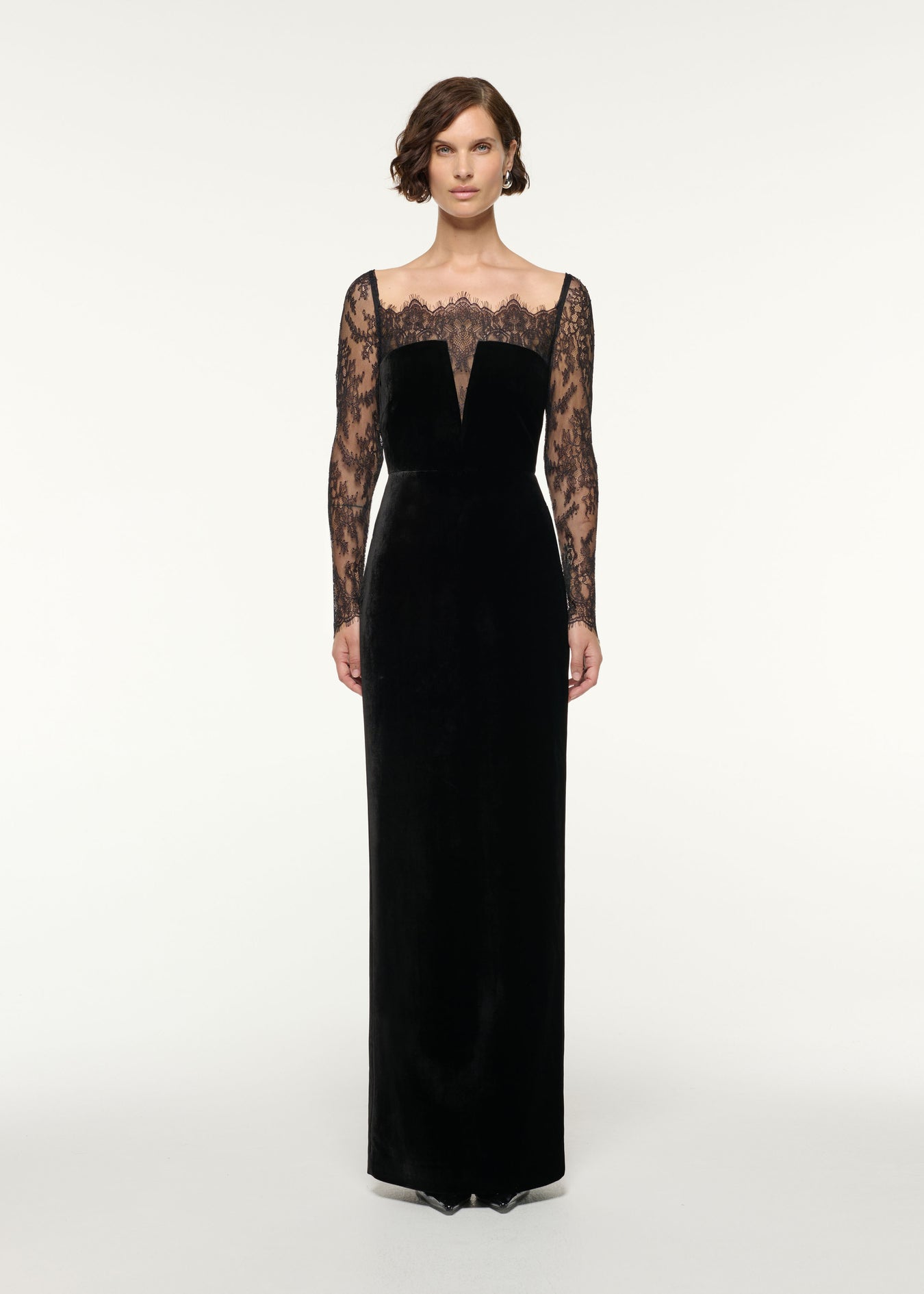 Front view of a model wearing the Scalloped Lace And Velvet Gown in Black