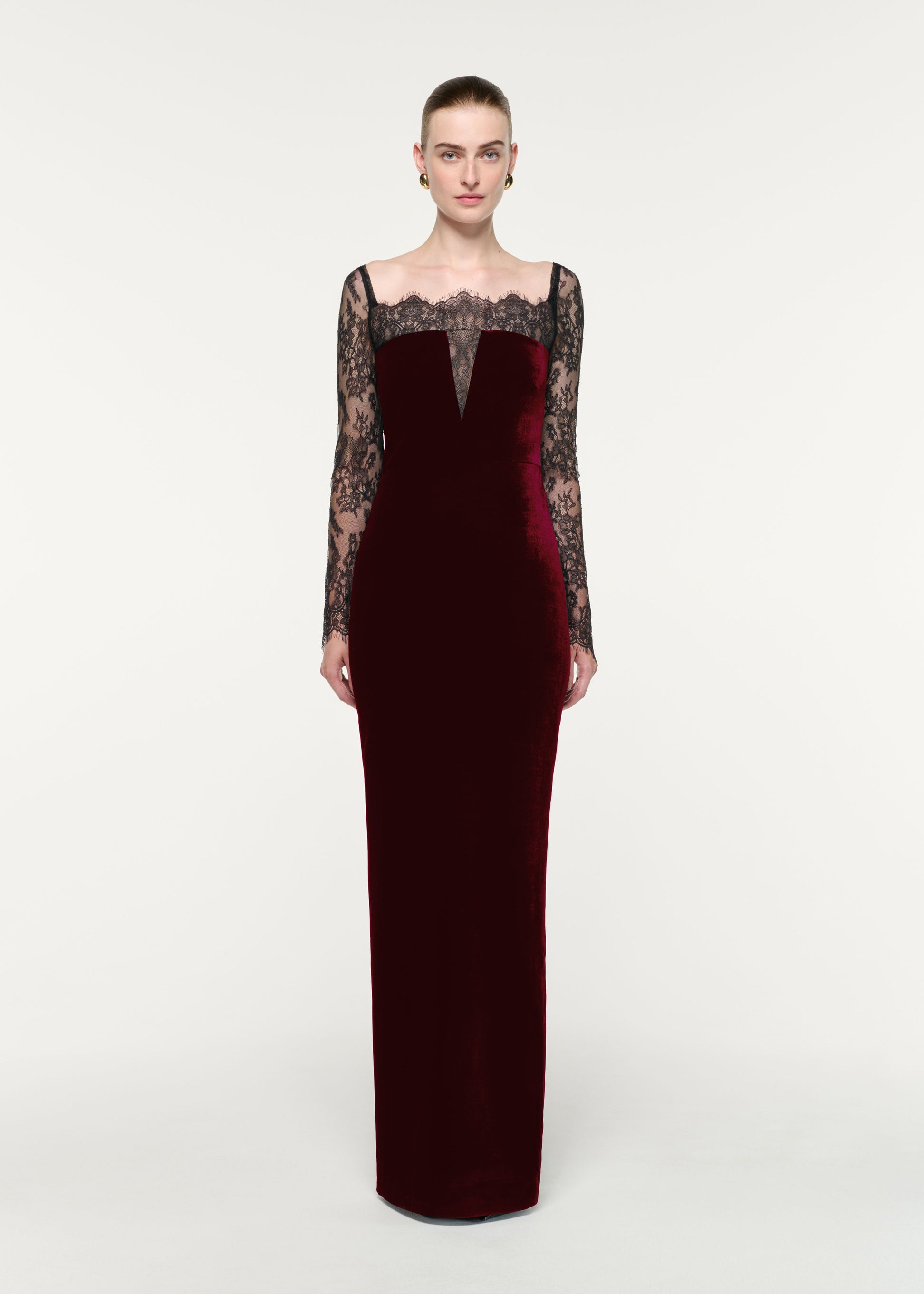Front view of a model wearing the Scalloped Lace And Velvet Gown