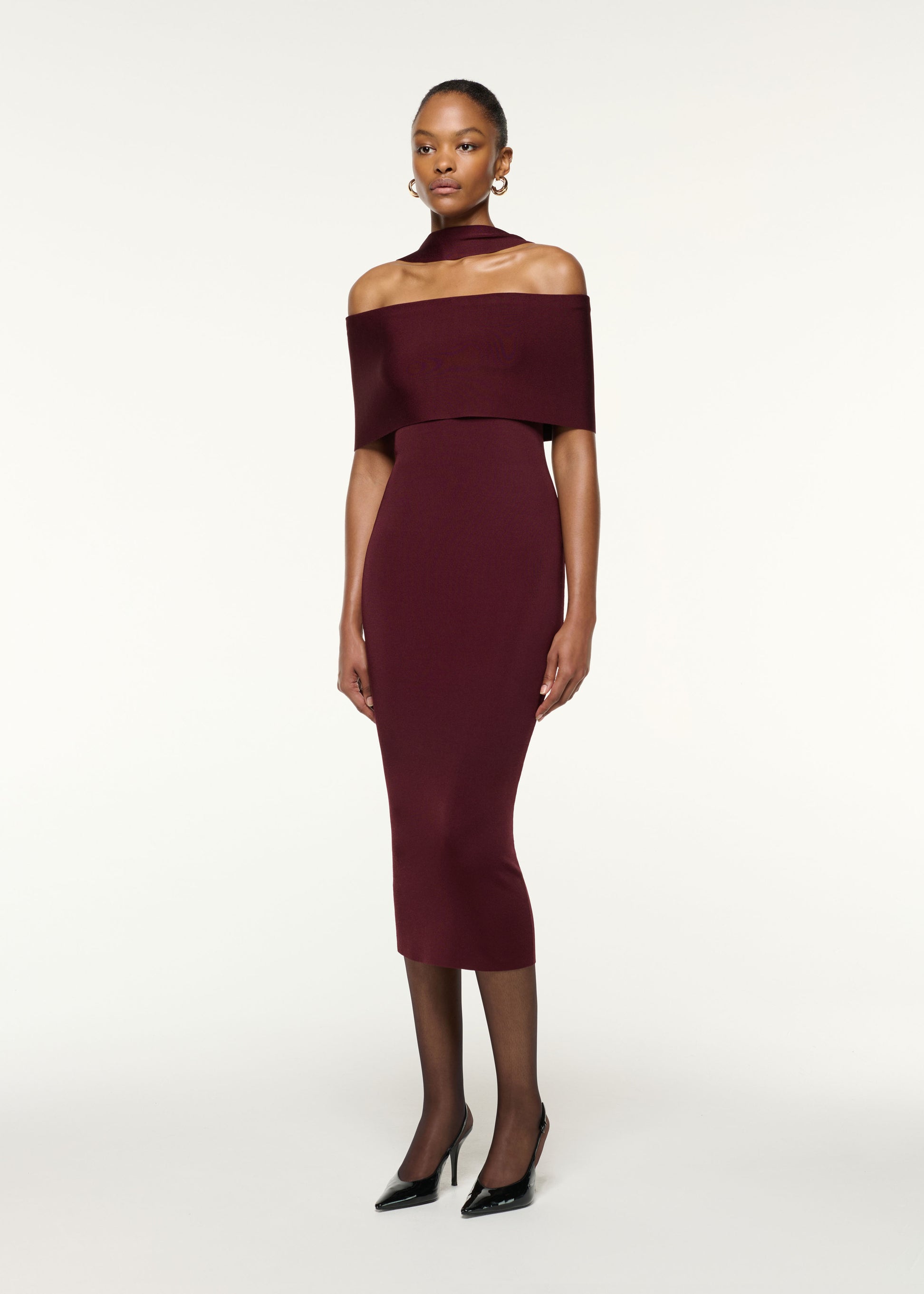 Side view of a model wearing the Scarf Detail Off The Shoulder Knit Dress in Mulberry