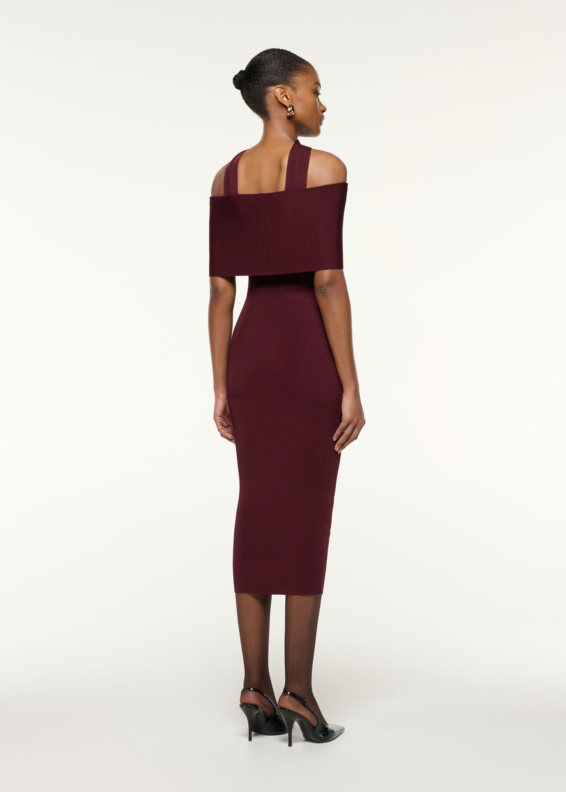 Back view of a model wearing the Scarf Detail Off The Shoulder Knit Dress in Mulberry