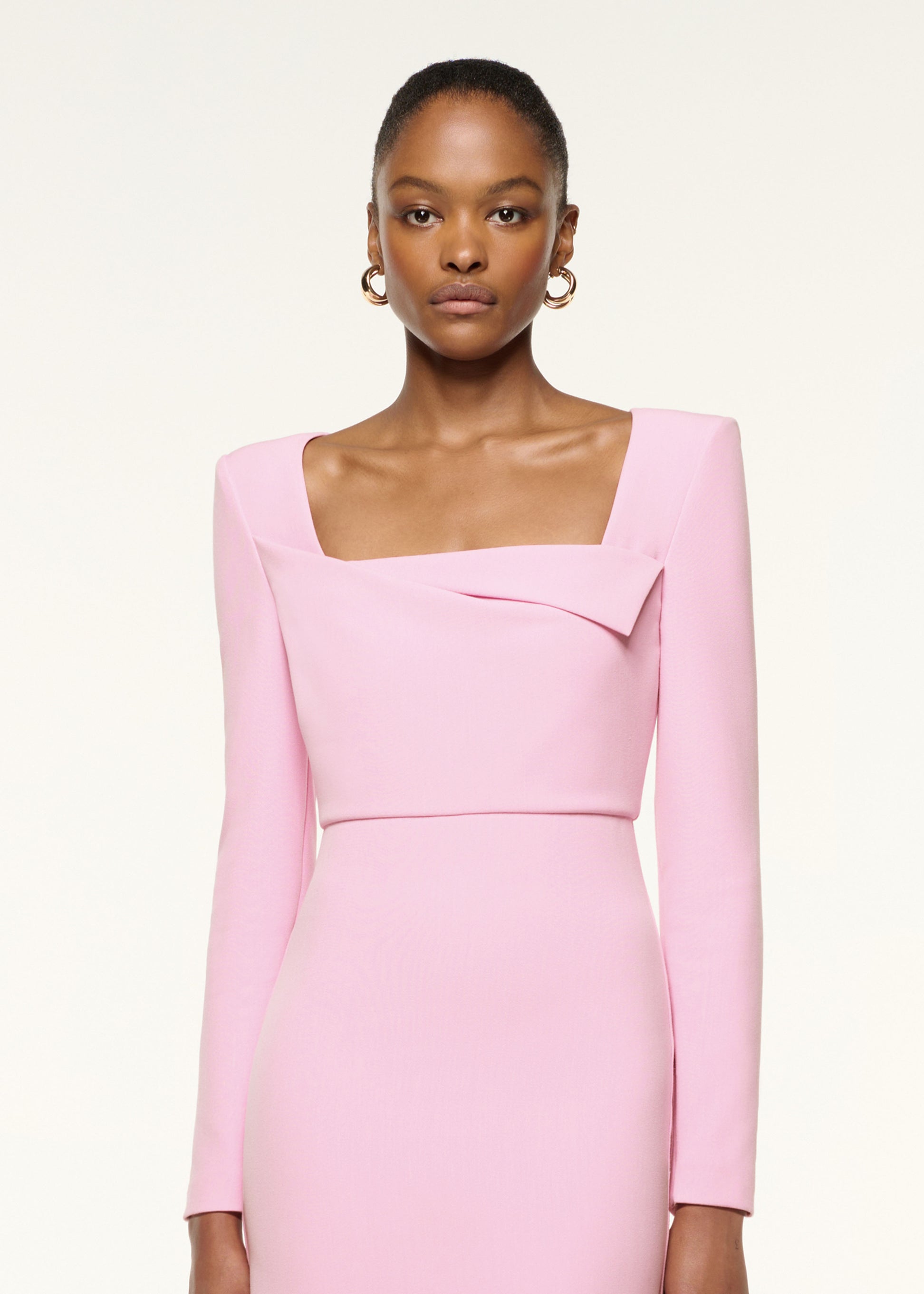 Close up of a model wearing the Origami Square Neckline Column Dress in Pink