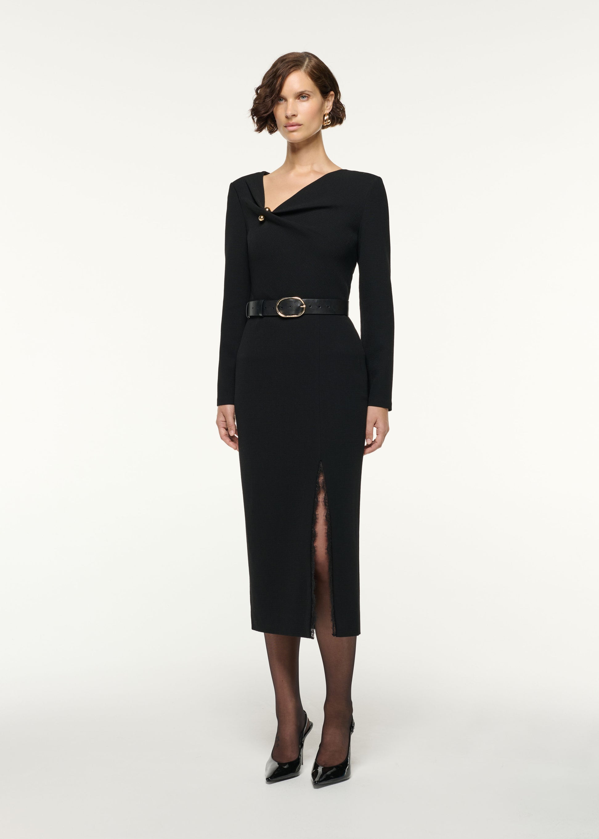 Side view of a model wearing the Asymmetrical Draped Neck Wool Top in Black