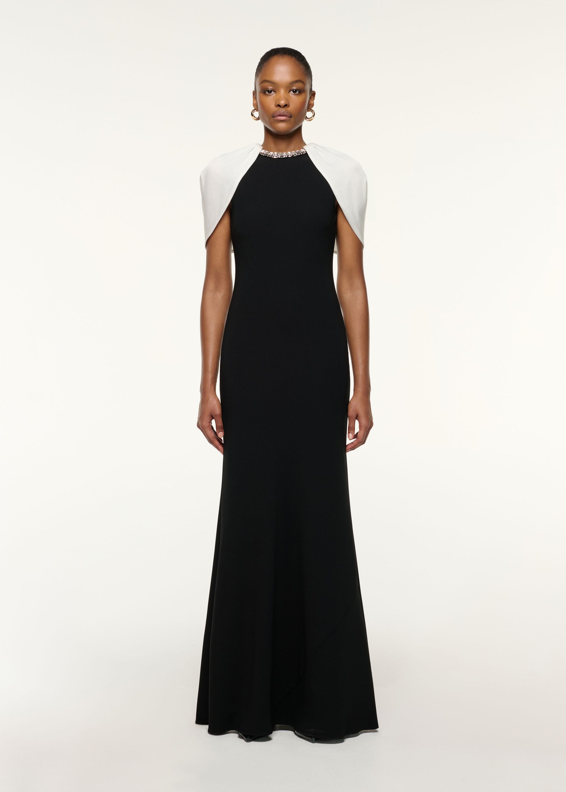 Front view of a model wearing the Gathered Shawl Crystal Trim Neckline Gown in Monochrome