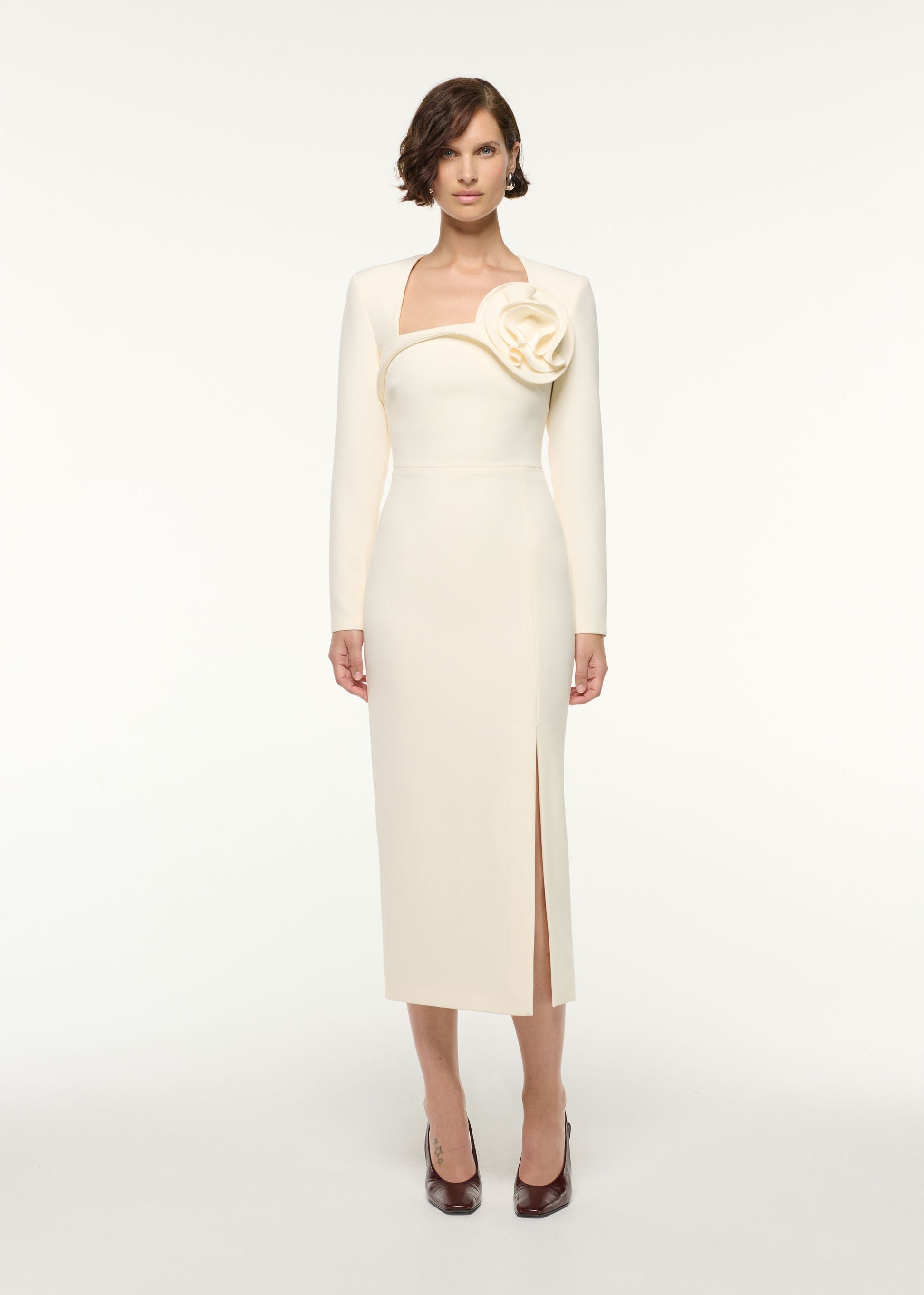 Front view of a model wearing the Flower Detail Cocktail Midi Dress in Cream