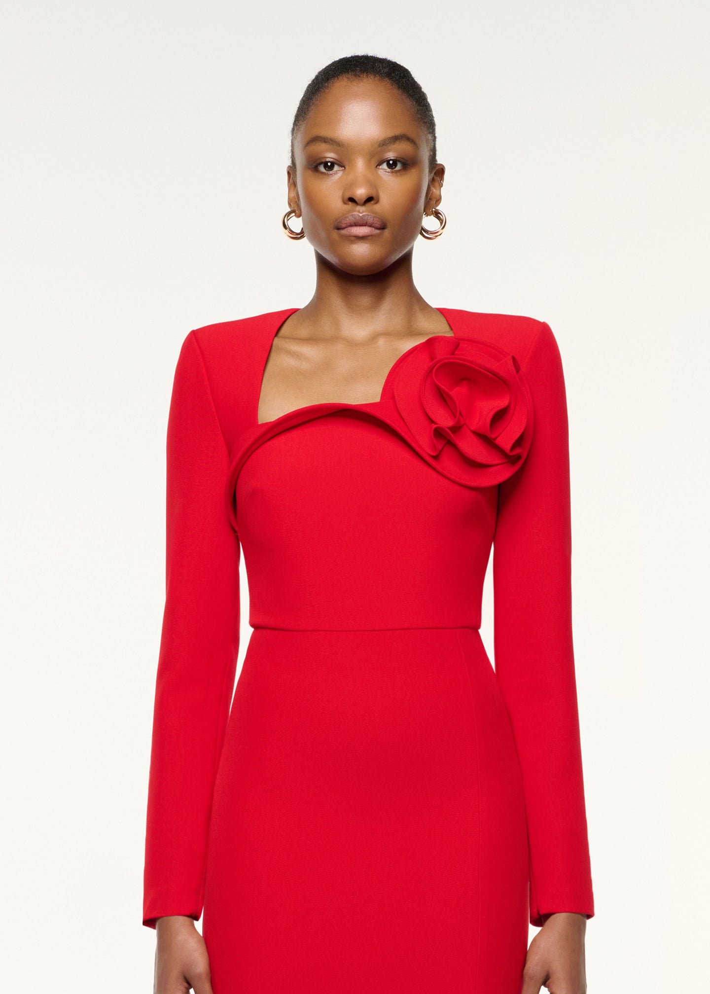 Close up of a model wearing the Flower Detail Cocktail Midi Dress in Red