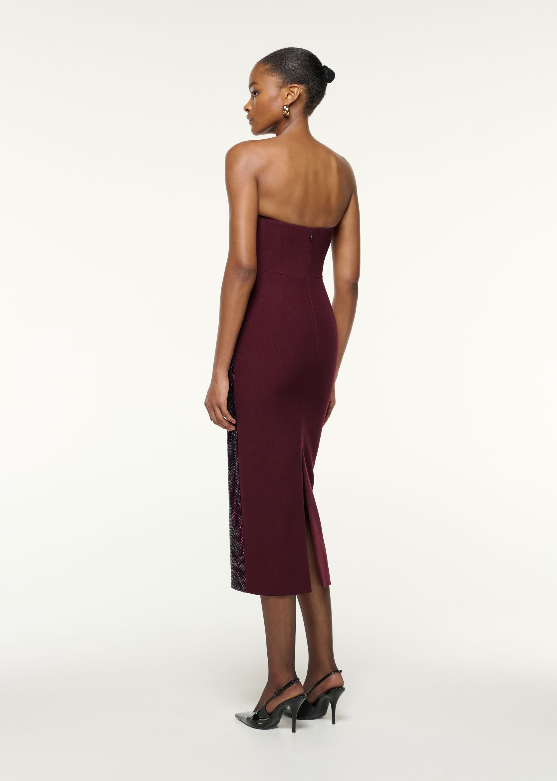 Back view of a model wearing the Asymmetrical Fold Diamante Cocktail Dress in Mulberry