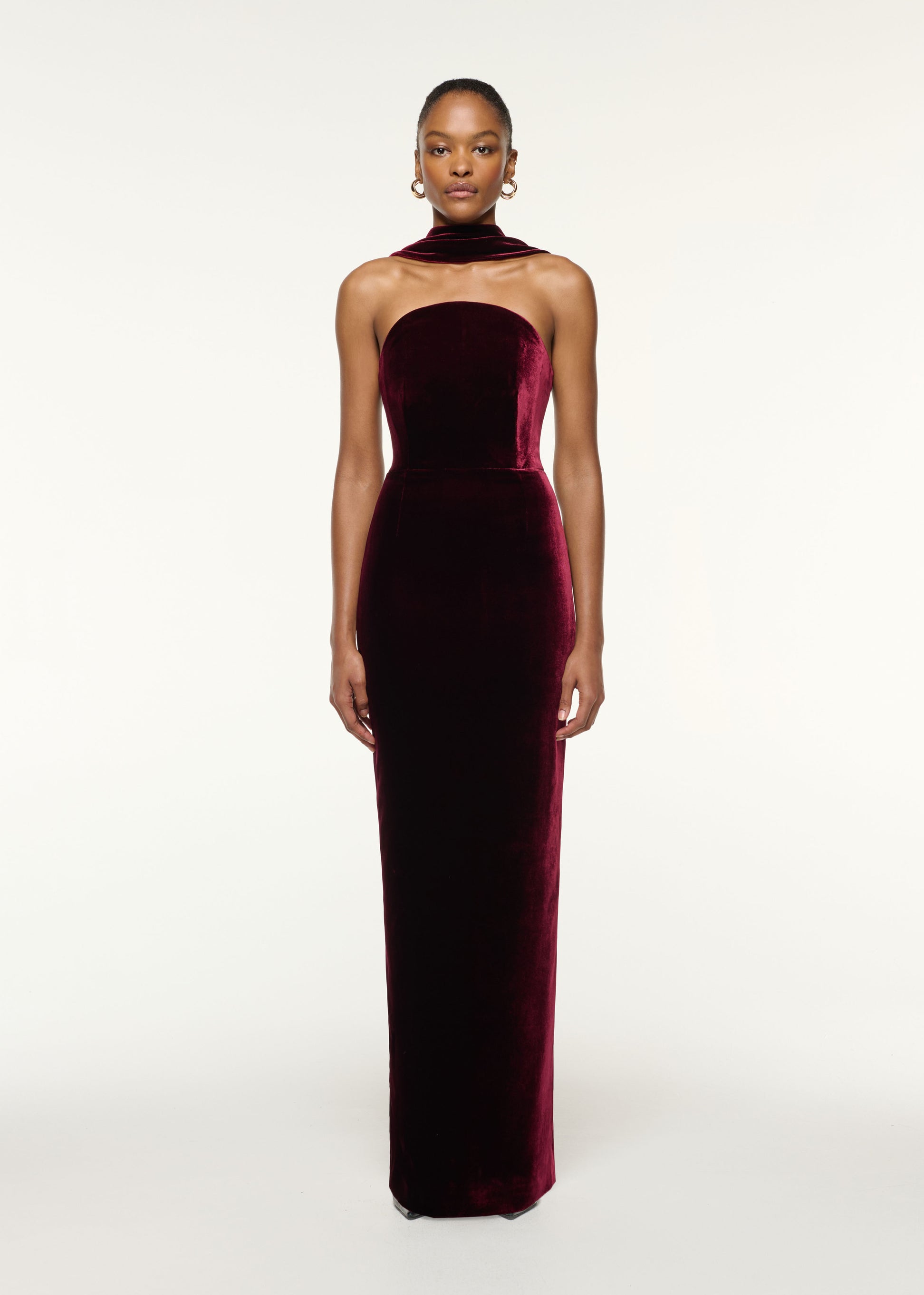 Front view of a model wearing the Scarf Detail Velvet Moon Gown in Mulberry