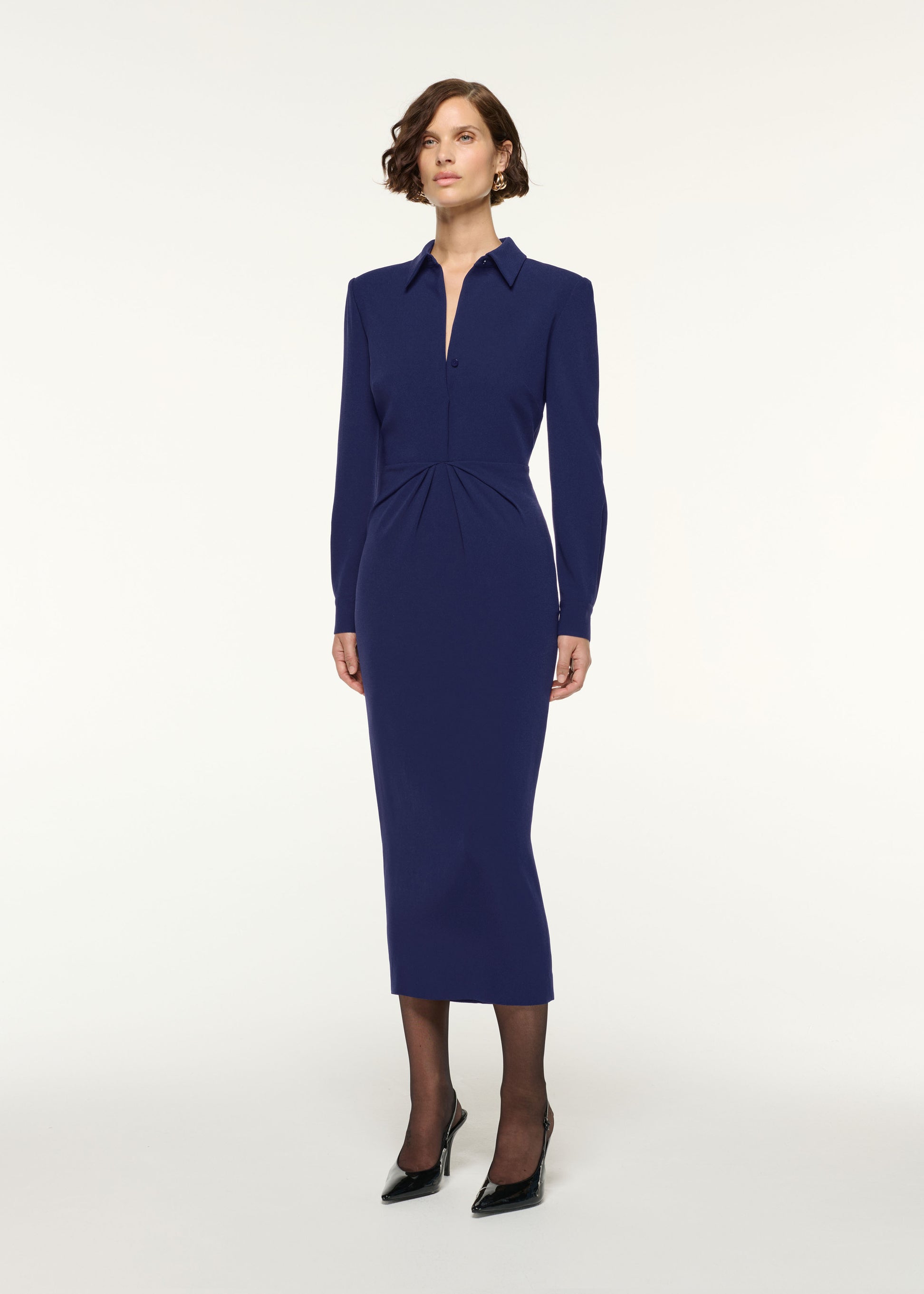 Side view of a model wearing the Gathered Drape Hip Midi Dress in Navy