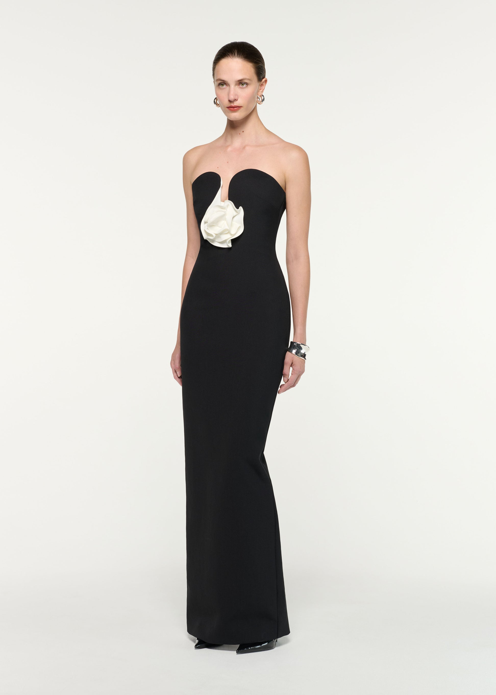 Side view of a model wearing the Strapless Monochrome Flower Gown