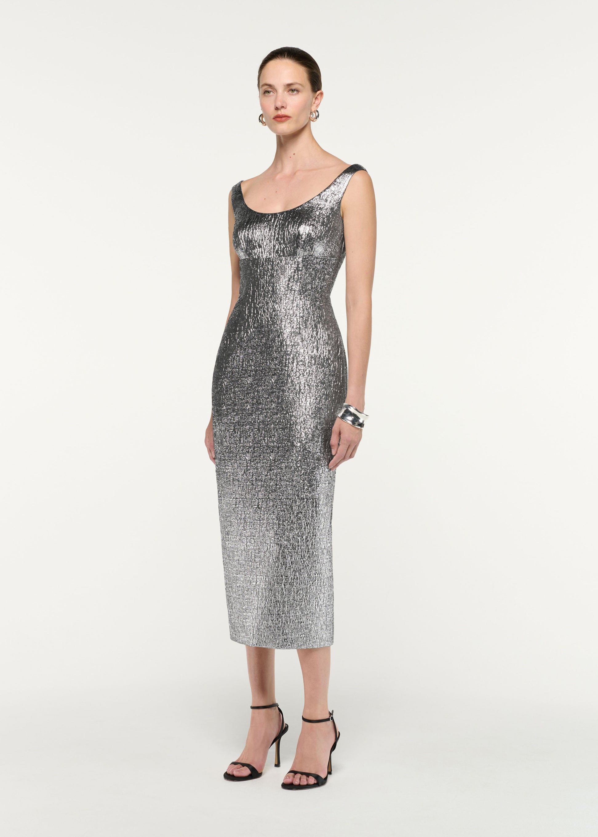 Side view of a model wearing the Metallic Jaquard Column Midi Dress