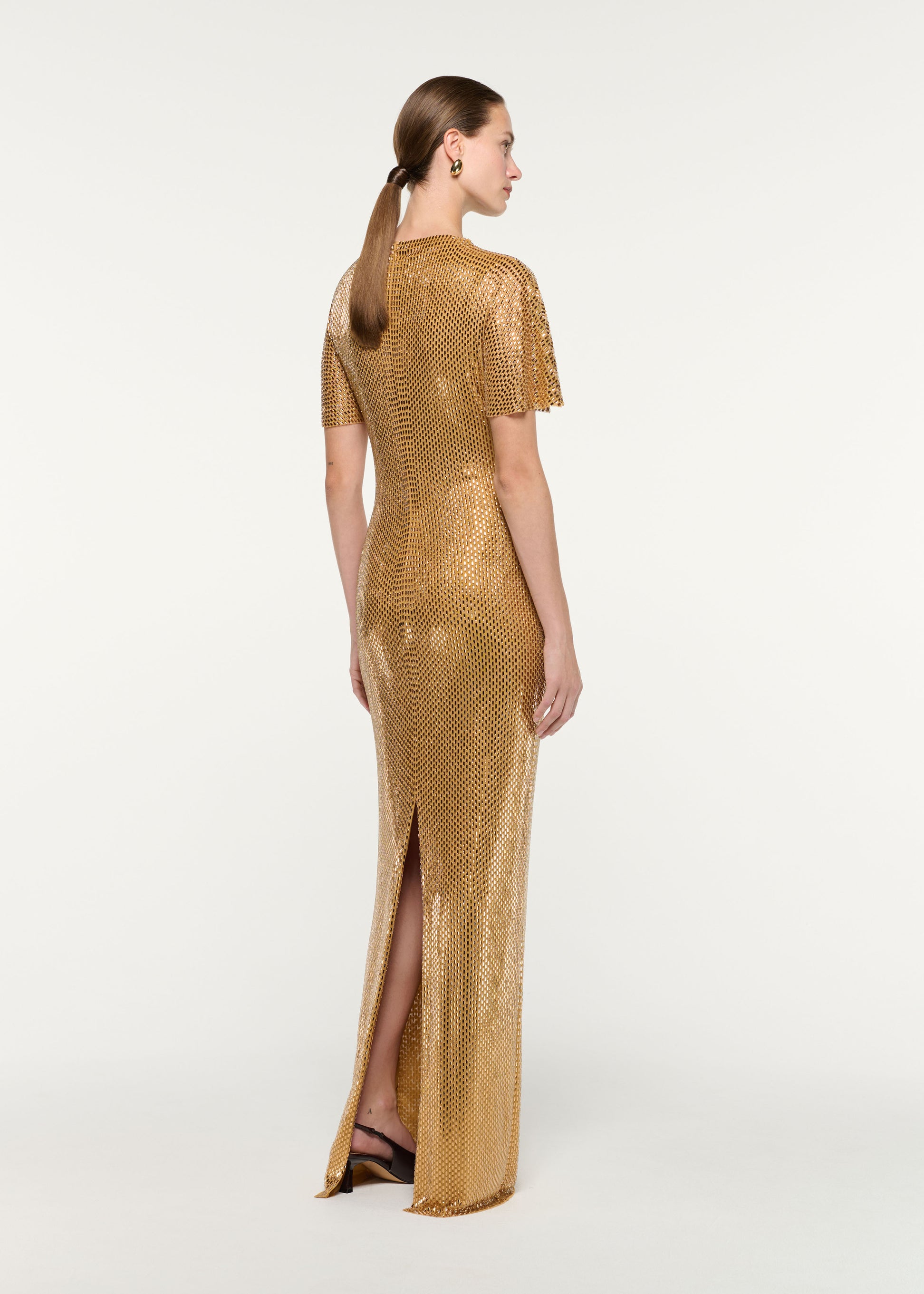 Back view of a model wearing the High Neck Diamante Short Sleeve Gown
