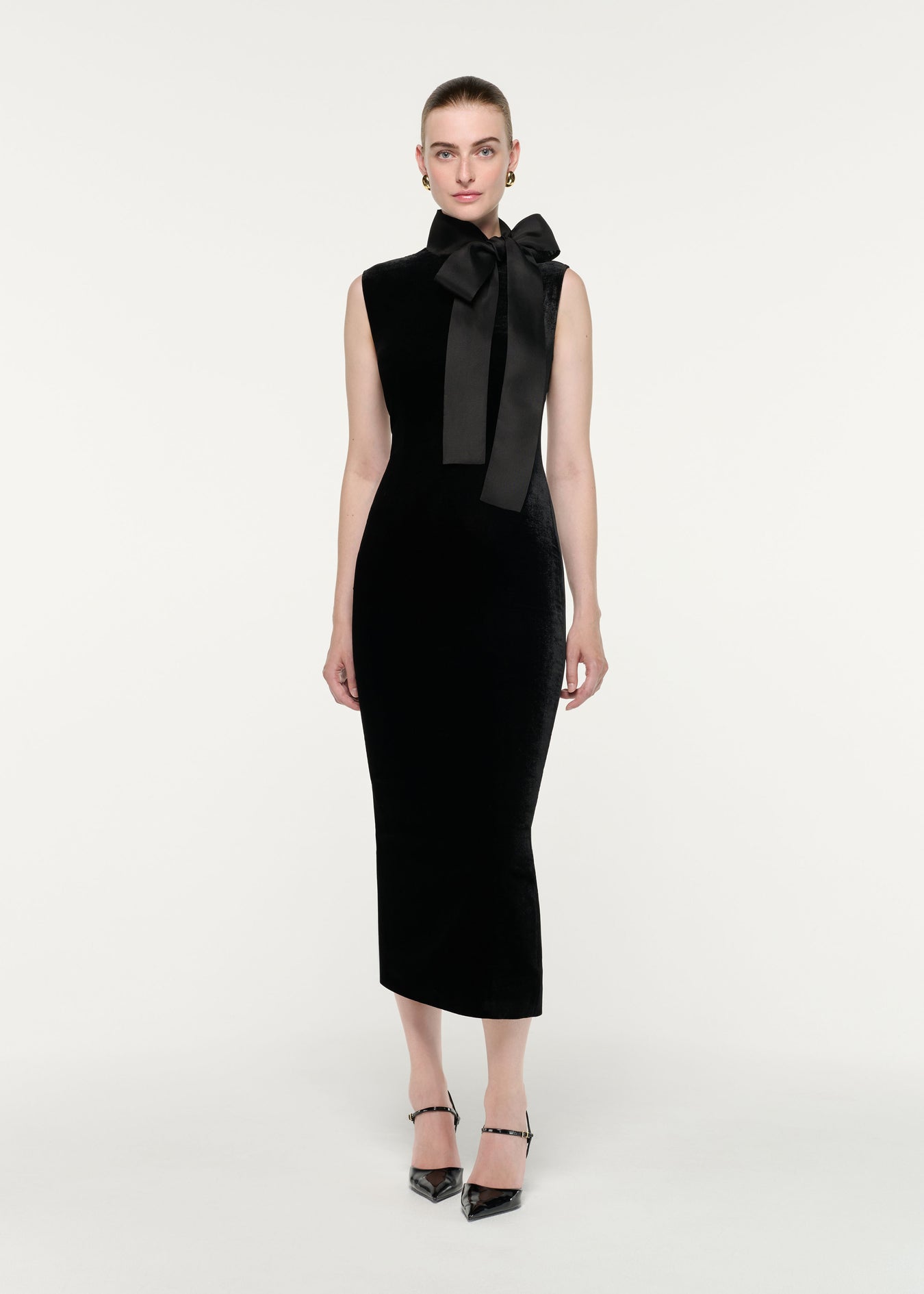 Front view of a model wearing the Velvet Midi Dress With Organza Bow Neck Tie