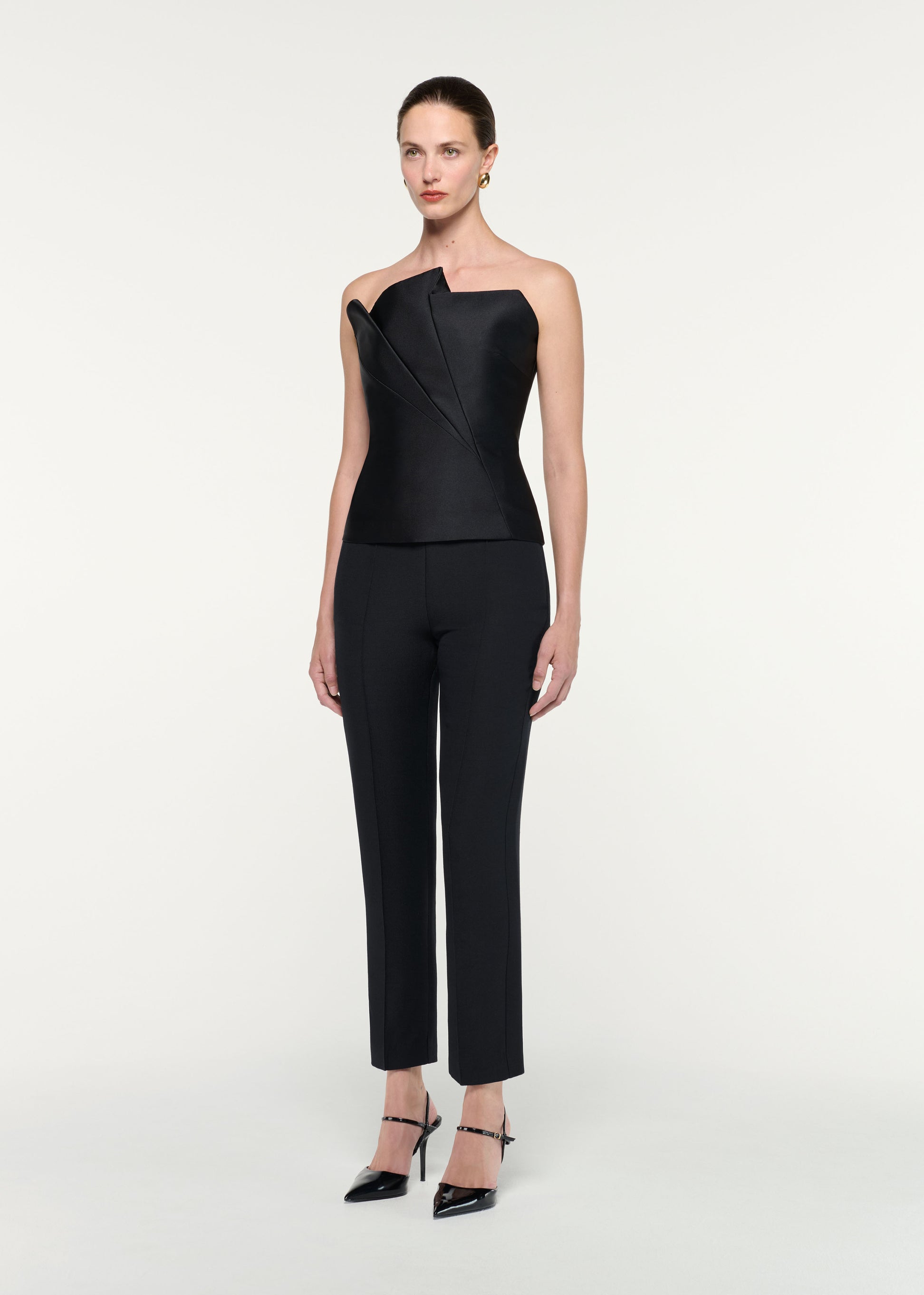 Side view of a model wearing the Pleated Strapless Taffeta Top