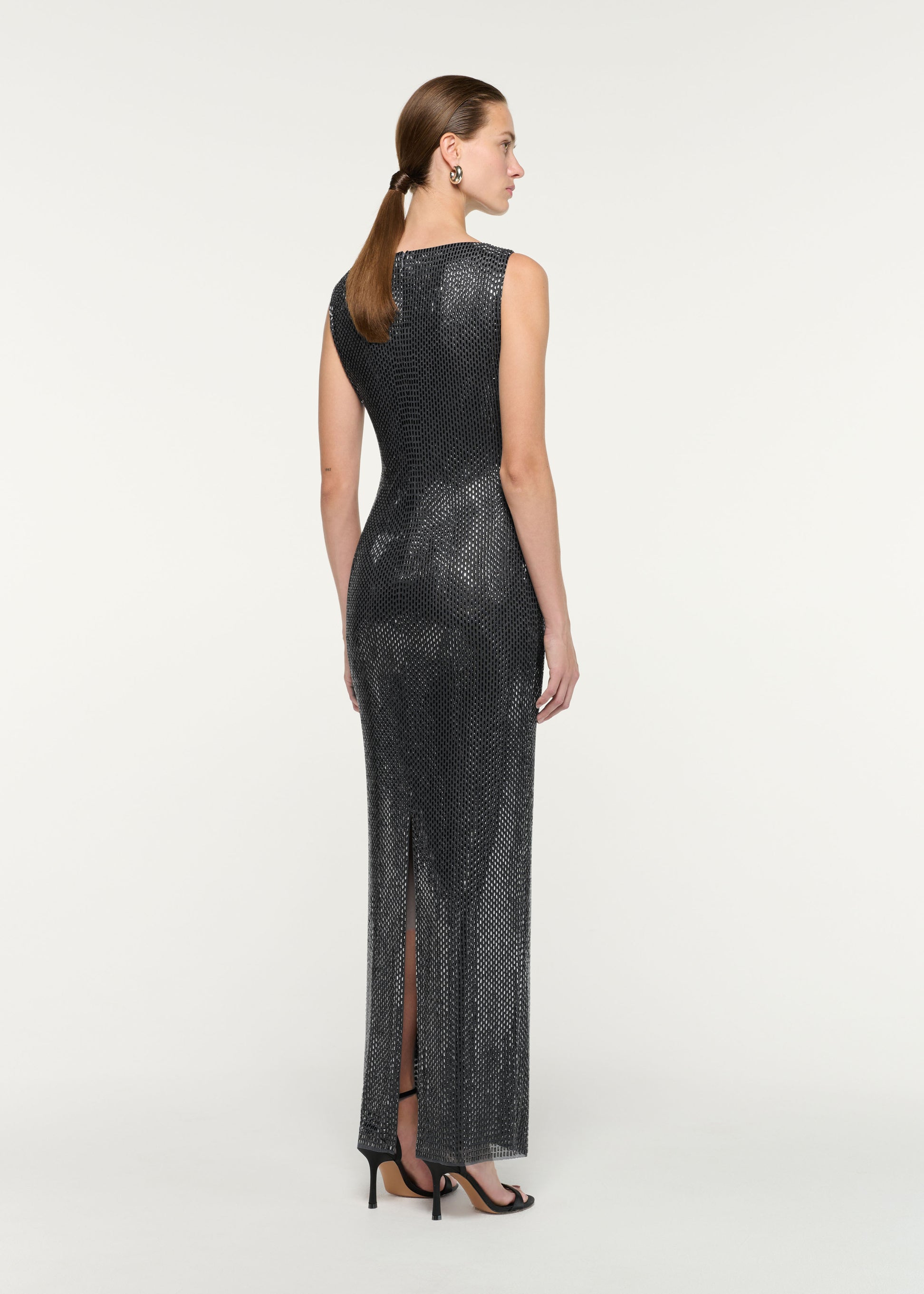 Back view of a model wearing the Flower Brooch Diamante Maxi Dress
