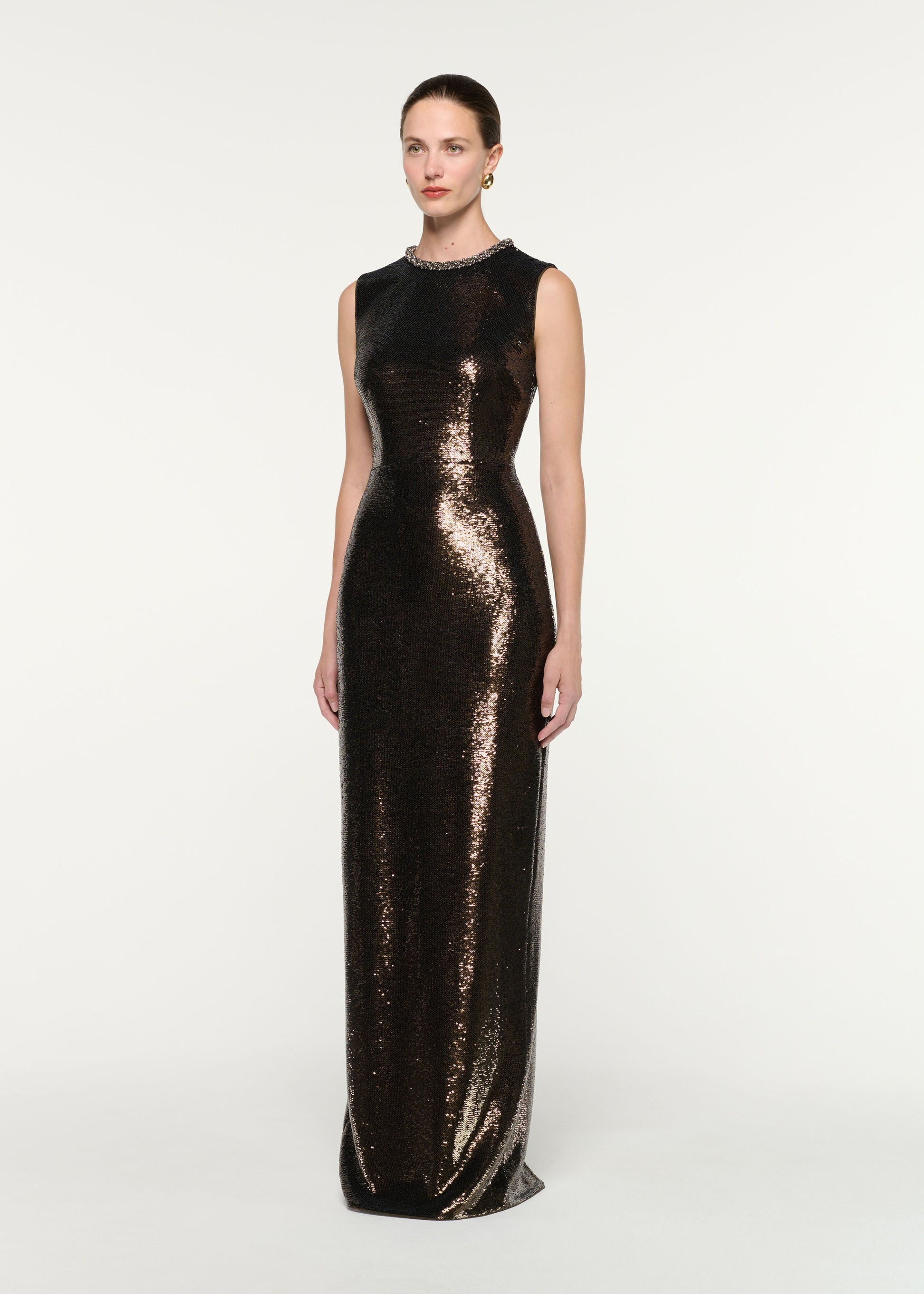 Side view of a model wearing the Embellished Neck Sequin Gown