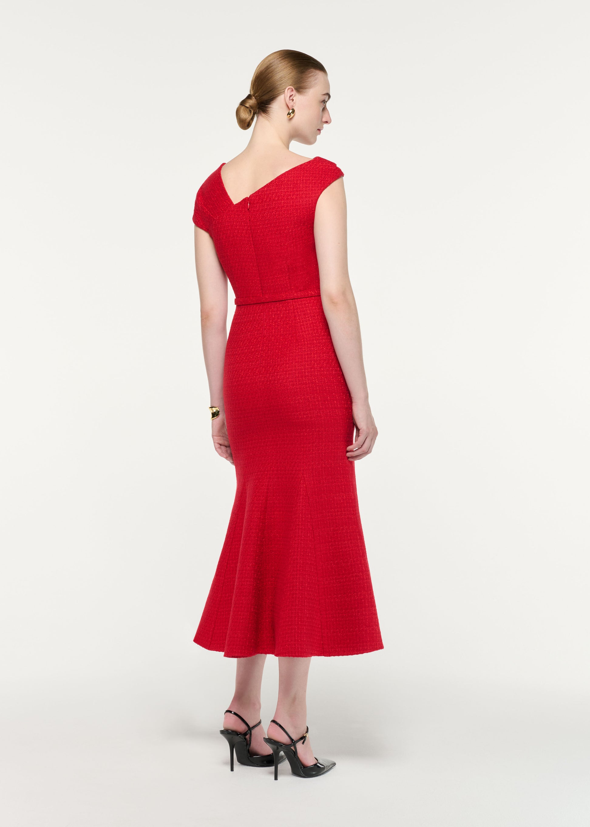 Back view of a model wearing the Asymmetric Neckline Boucle Midi Dress