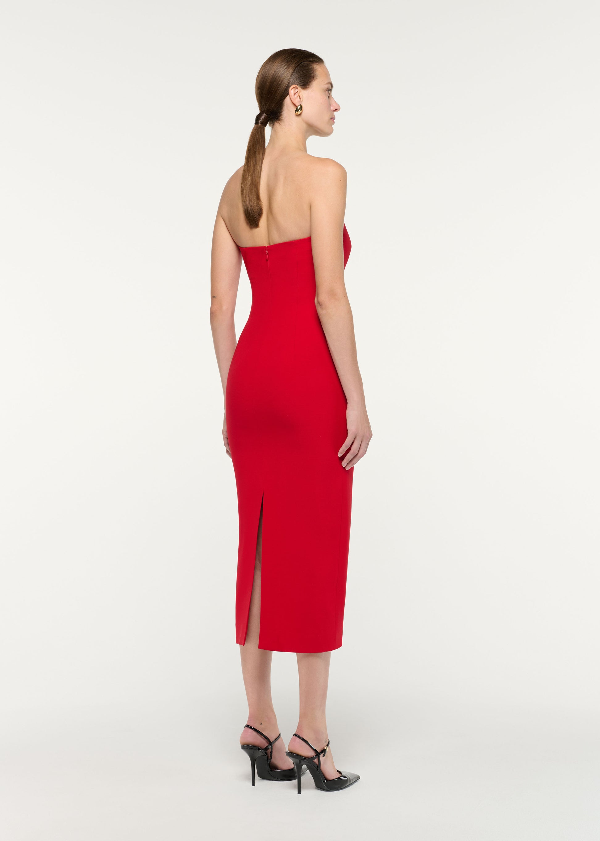 Back view of a model wearing the Strapless Wool Silk Midi Dress