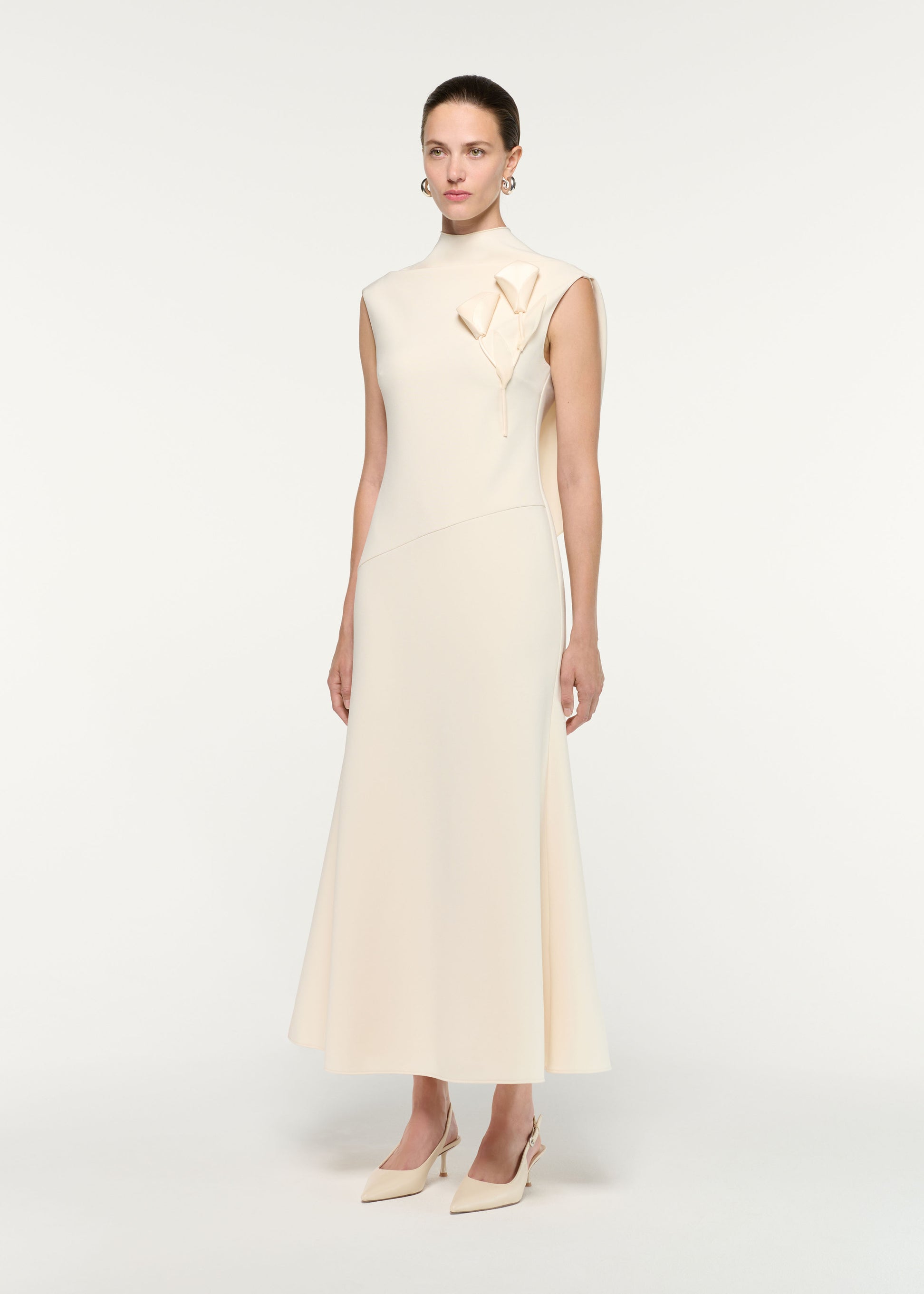 Side view of a model wearing the Flower Embroidery Crepe Midi Dress