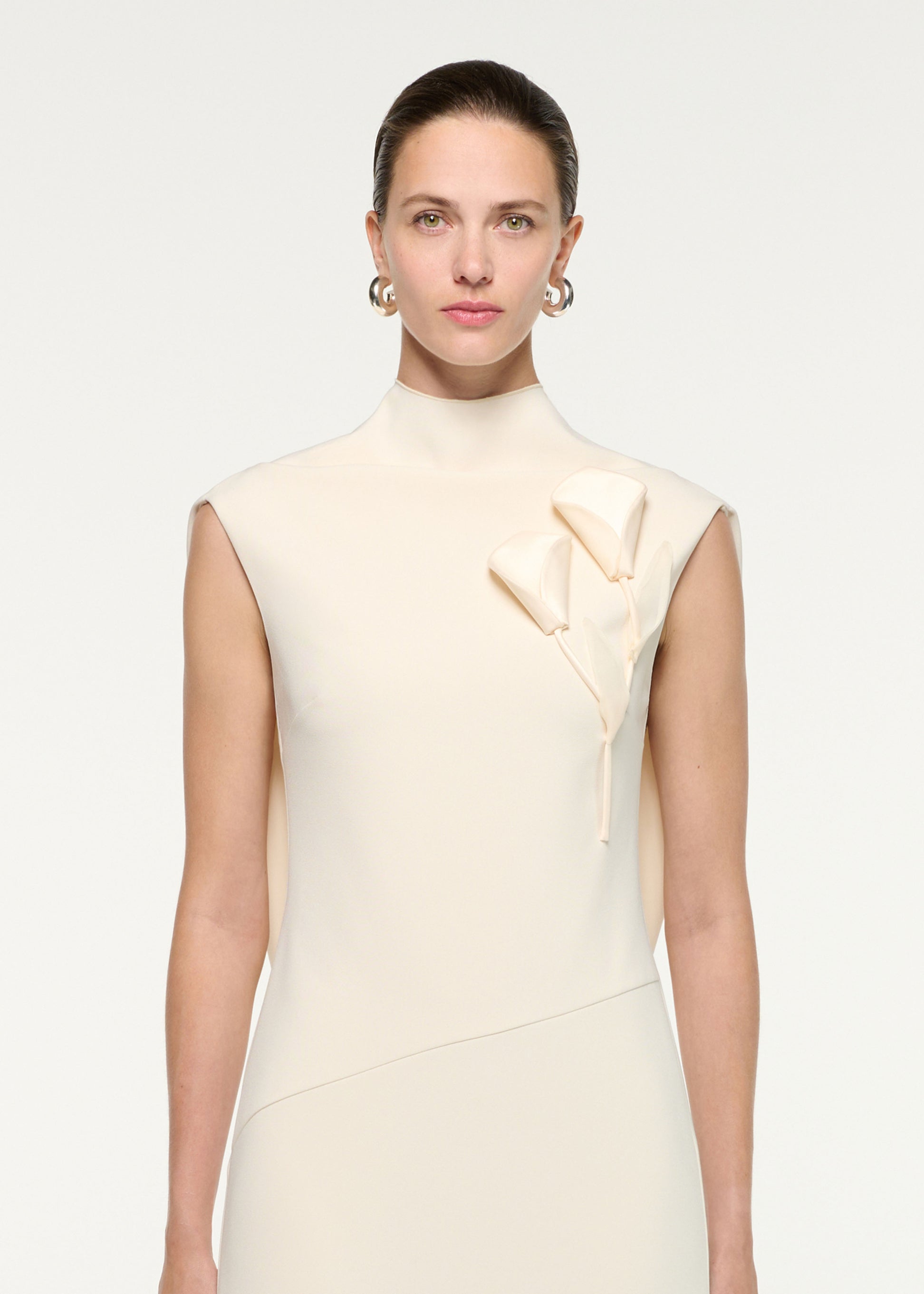 Close up of a model wearing the Flower Embroidery Crepe Midi Dress