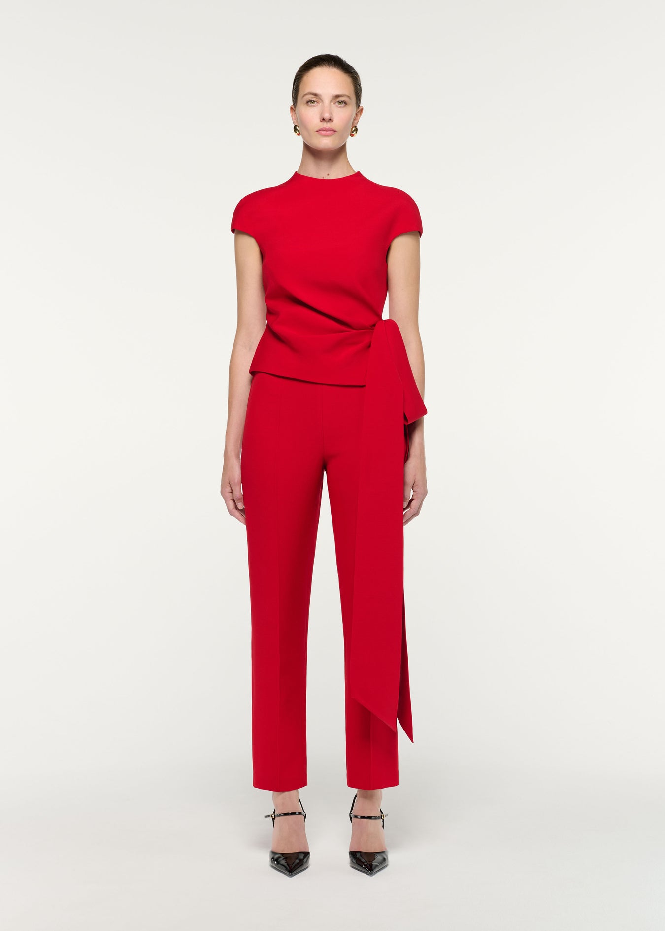 Front view of a model wearing the High Neck Wool Silk Bow Detail Top
