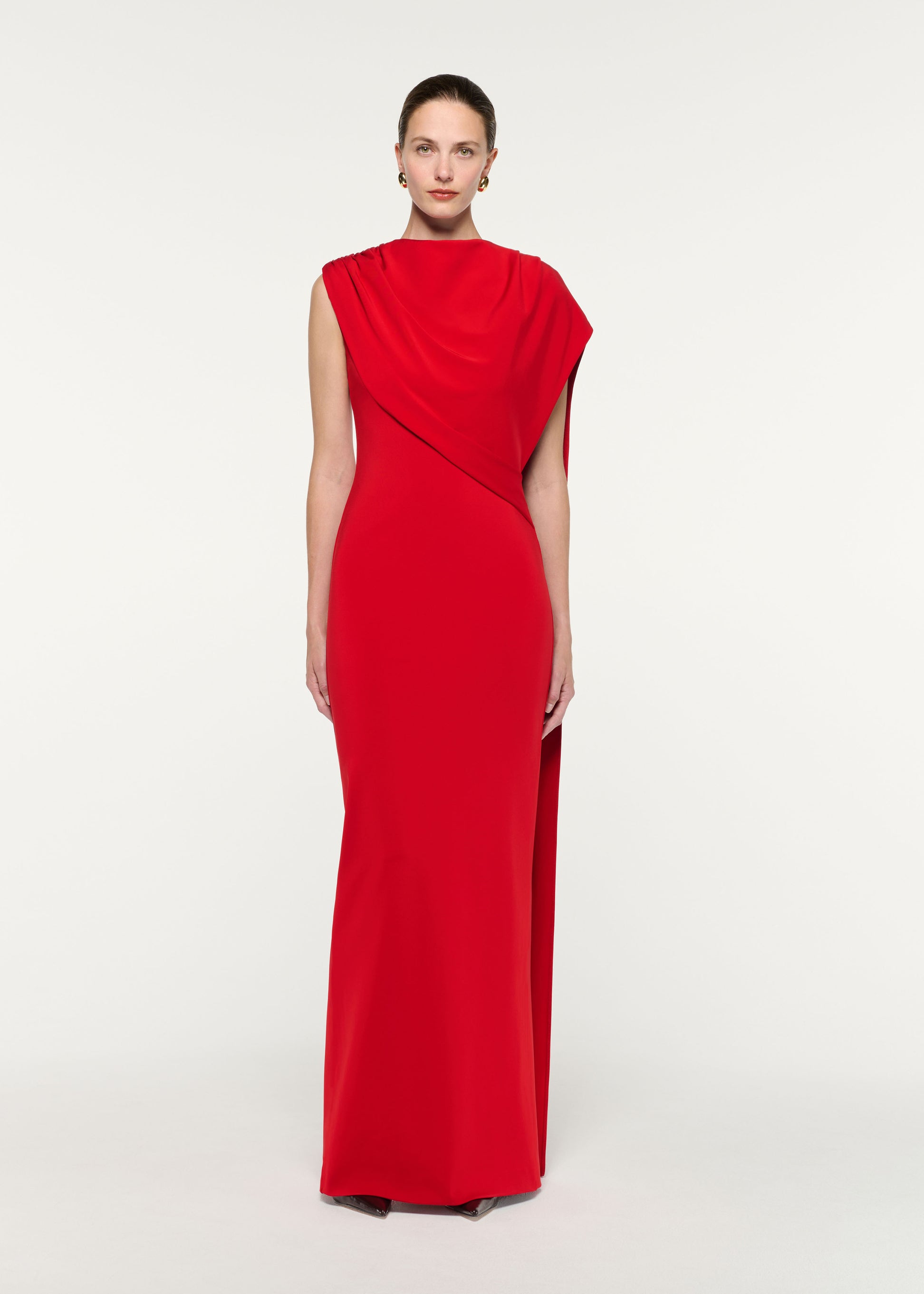 Front view of a model wearing the Asymmetric Cape Gown