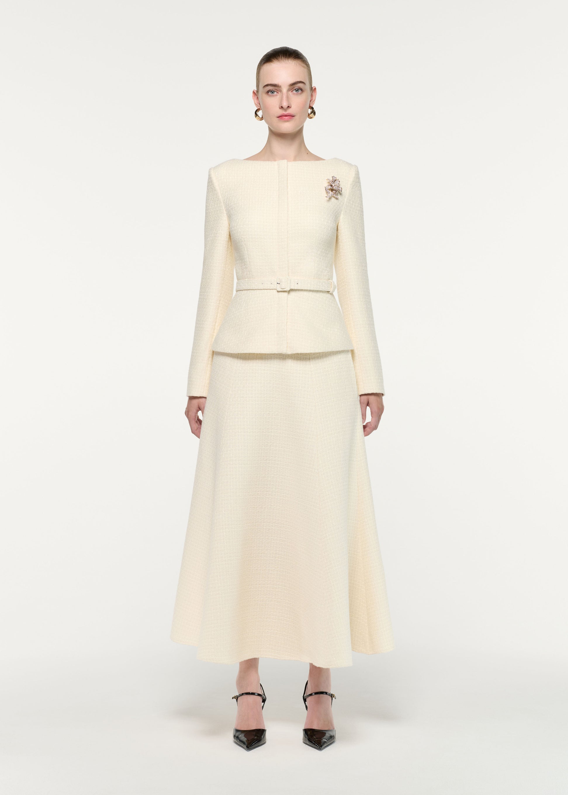 Front view of a model wearing the Flower Brooch Boucle Jacket