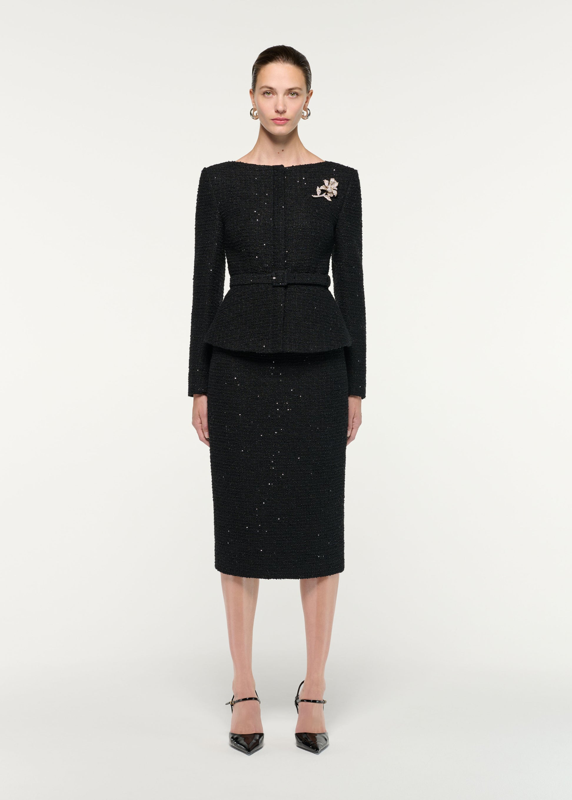 Front view of a model wearing the Flower Brooch Sequin Boucle Jacket