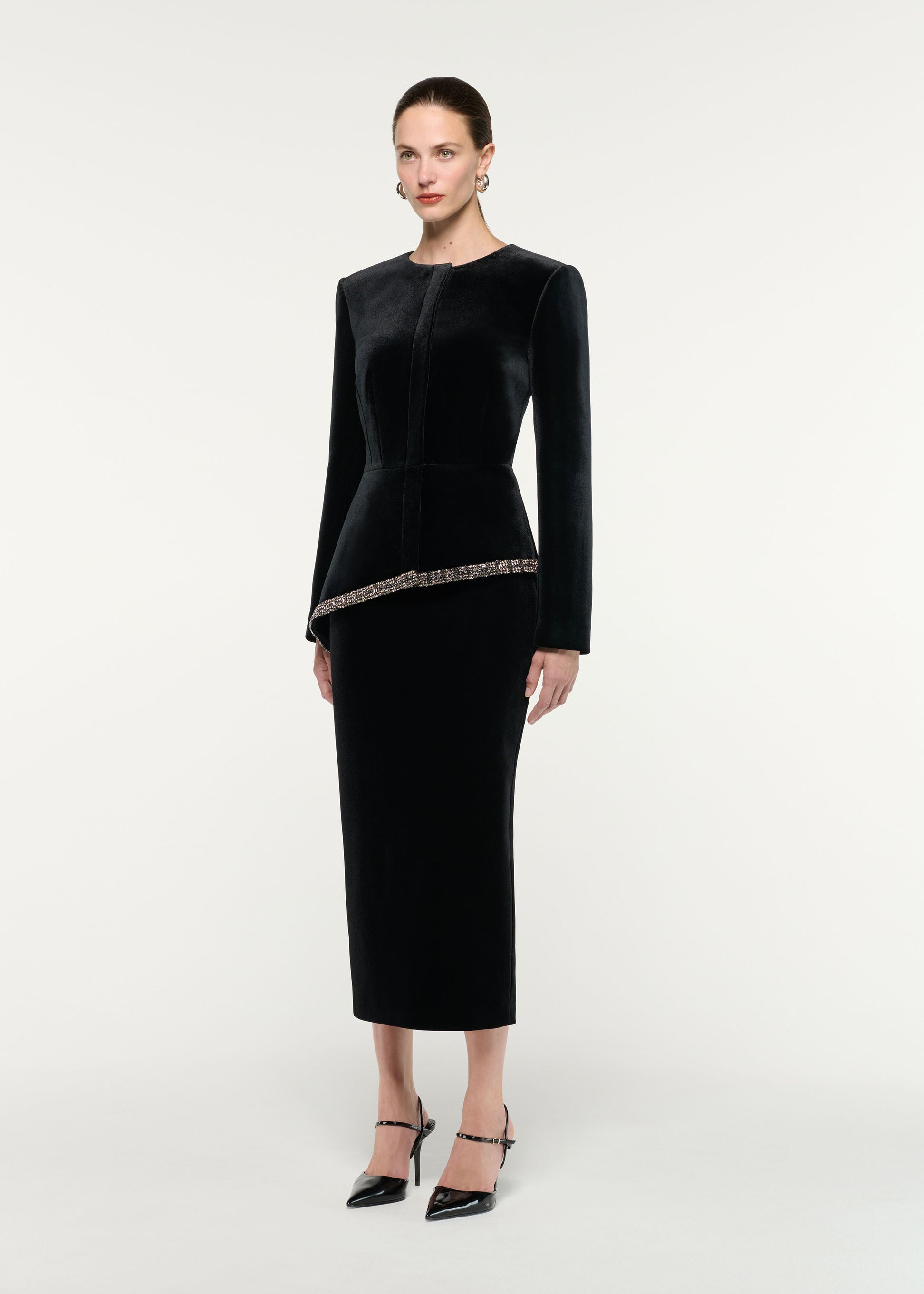 Side view of a model wearing the Velvet Embellished Trim Peplum Jacket