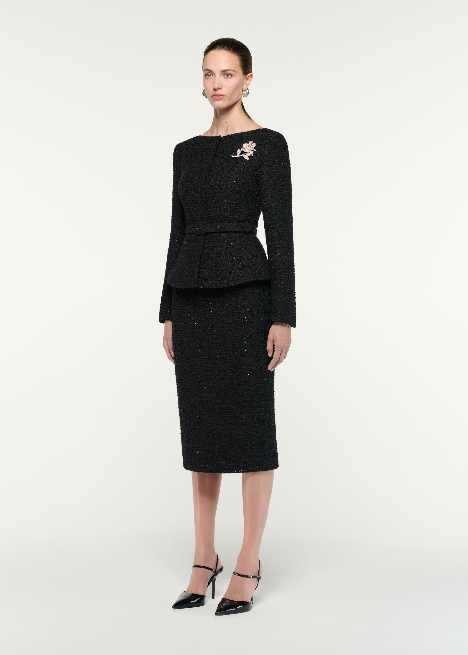 Side view of a model wearing the Sequin Boucle Midi Skirt