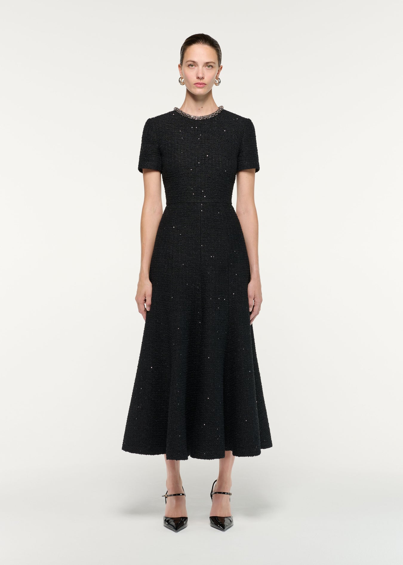 Front view of a model wearing the Embellished Neck Sequin Boucle Midi Dress