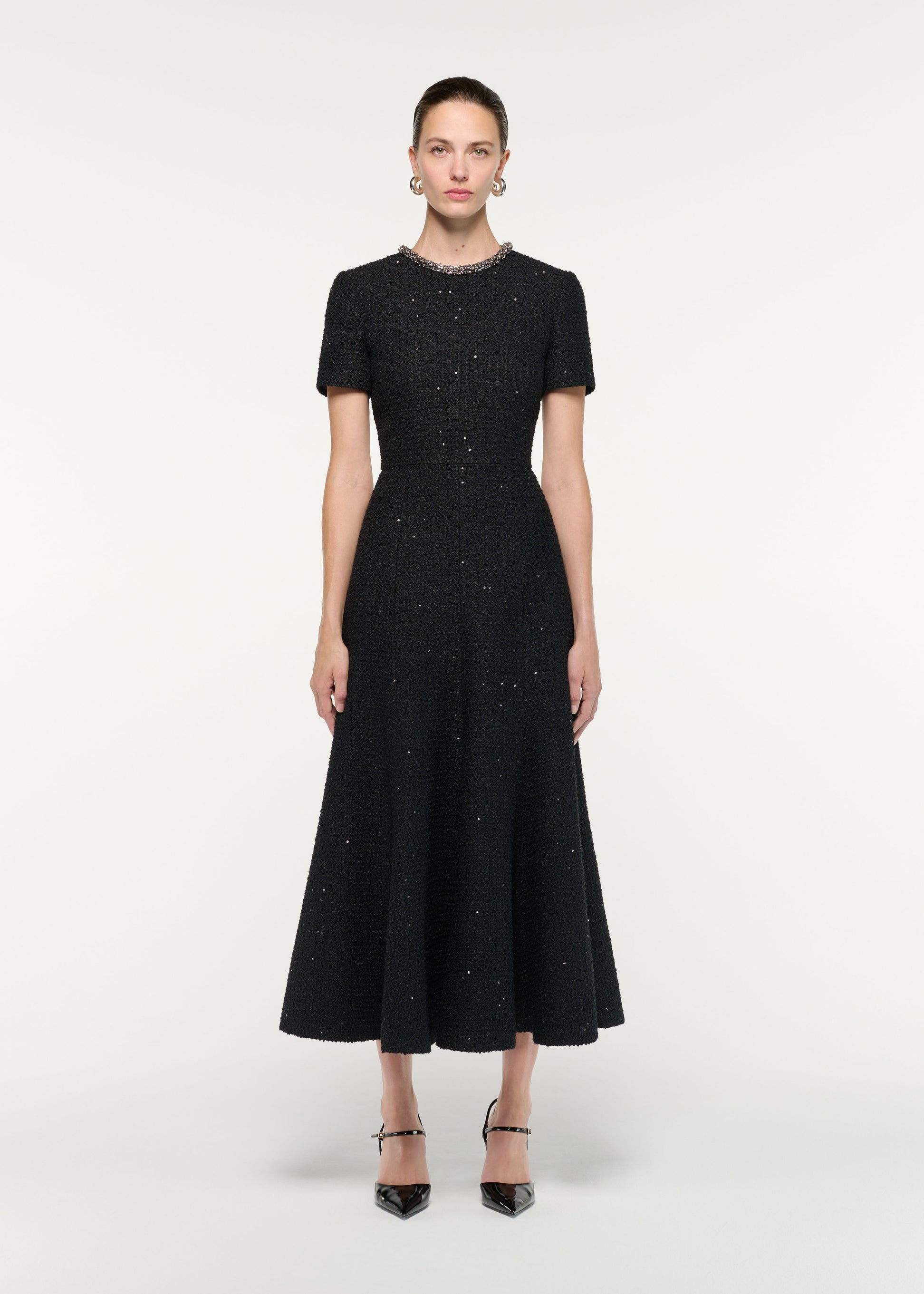Front view of a model wearing the Embellished Neck Sequin Boucle Midi Dress