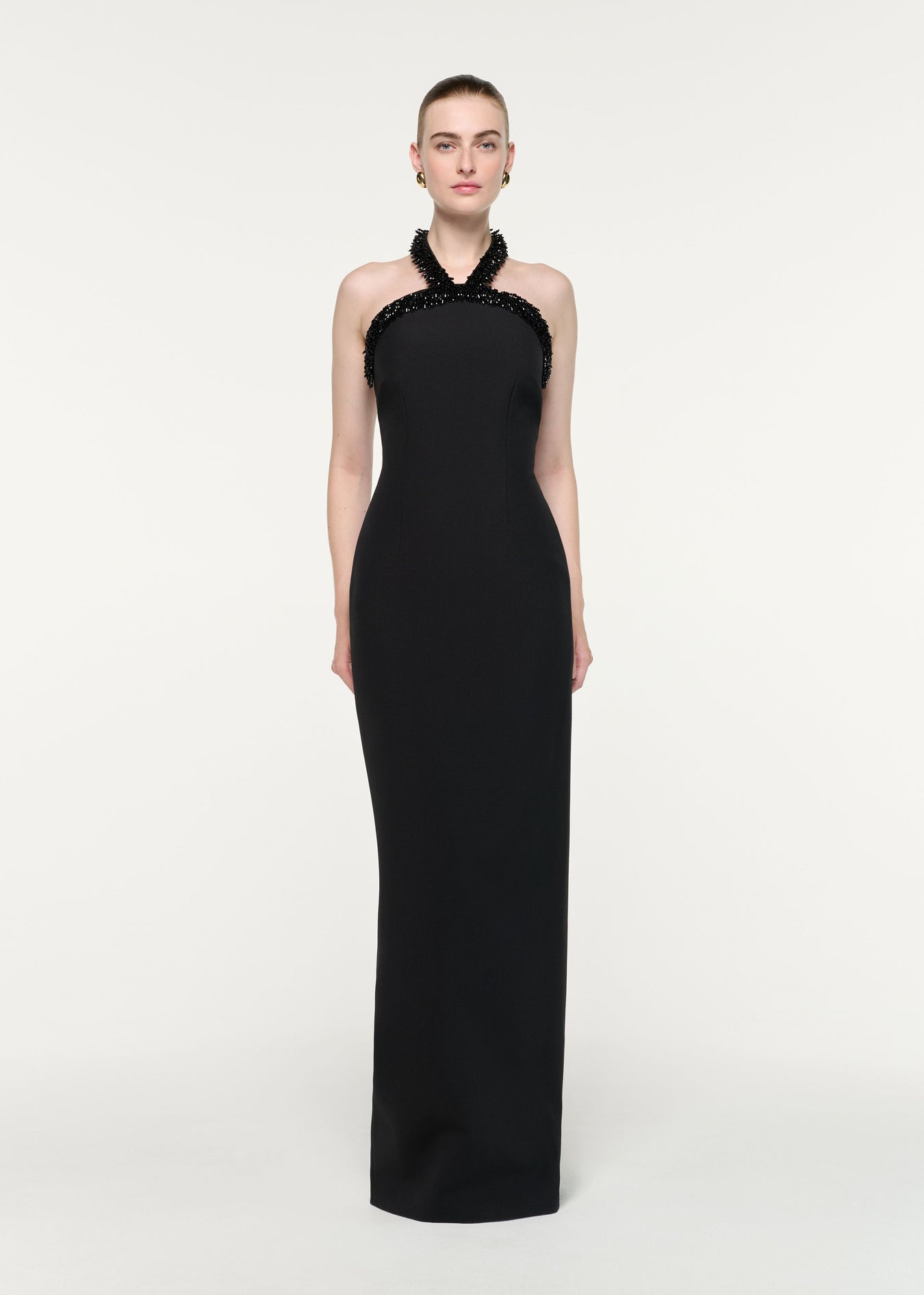 Front view of a model wearing the Embellished Halter Neck Crepe Gown