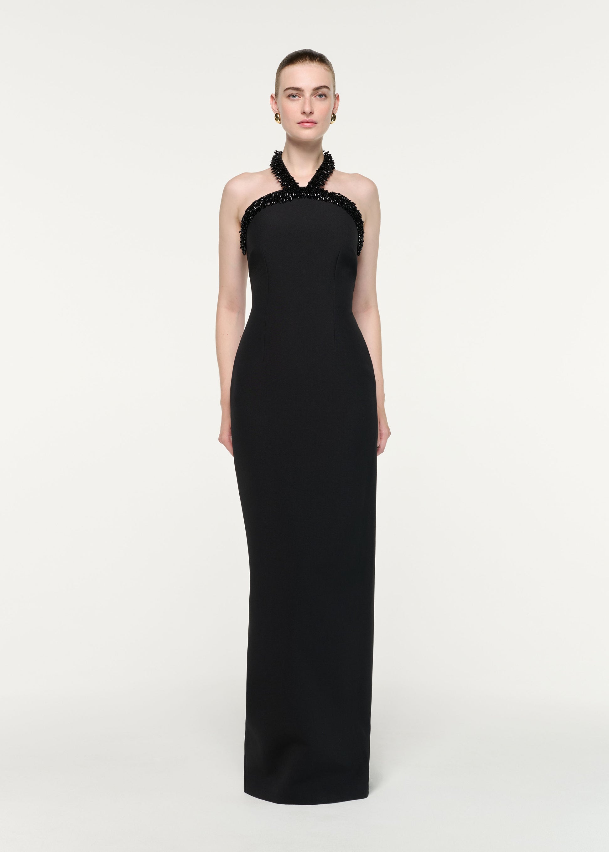 Front view of a model wearing the Embellished Halter Neck Crepe Gown